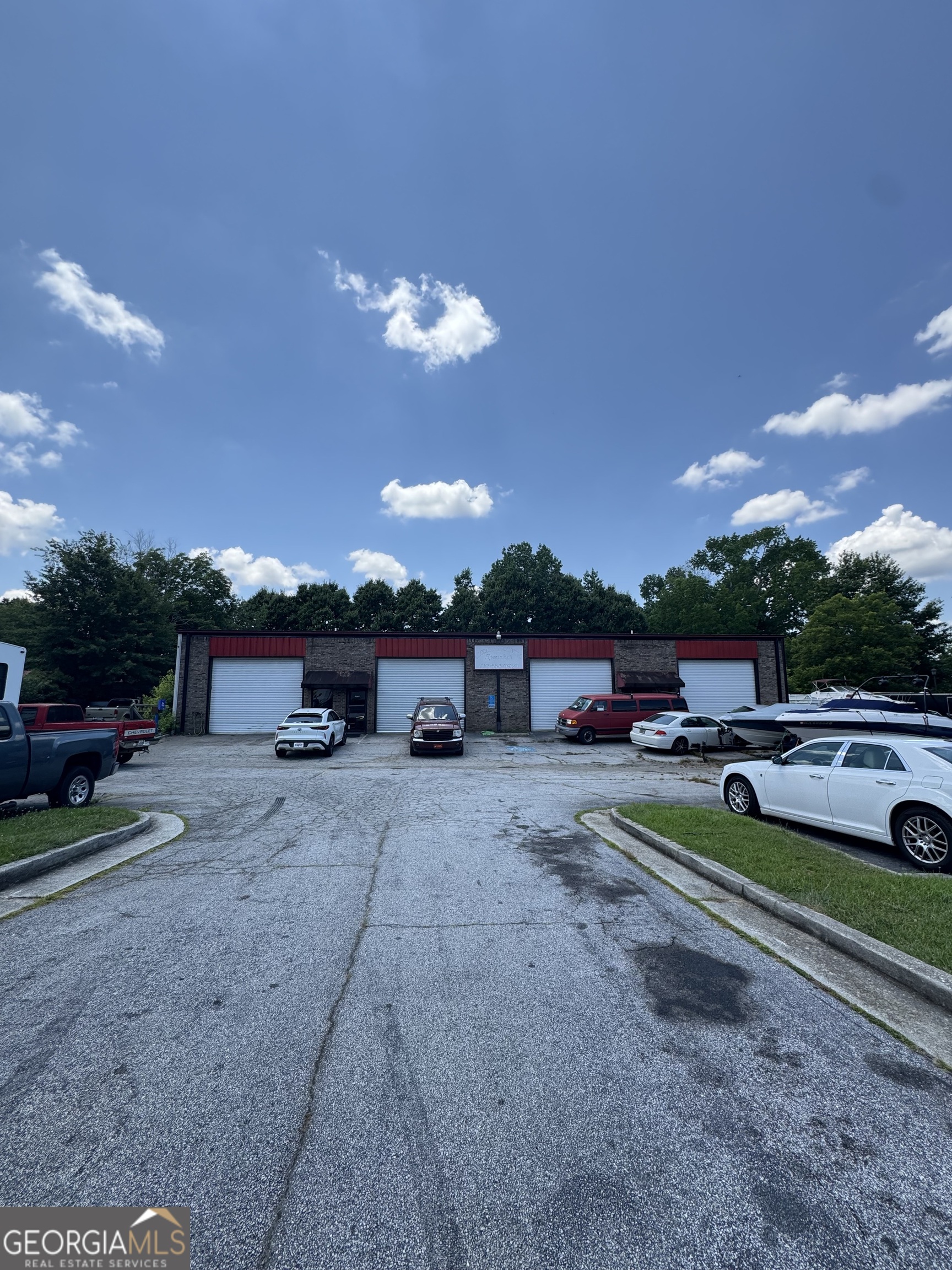 Dreaming of owning your own business? Situated in a sought-after area, this property enjoys high visibility and easy accessibility, making it an ideal location for businesses. Automotive shop with 5 Bays, 5000 Sq Ft. 2 separate meters, 2 separate entrances--ideal for owner to have tenants if desired. Plenty of parking. Current owner has been there since 1996. Don't miss out on this great opportunity.