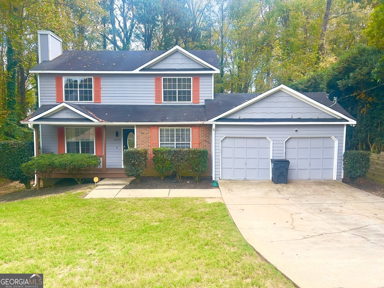 This charming 4-bedroom, 2-bathroom home blends comfort, space, and style in a prime location-close to shopping and entertainment, yet tucked away from the hustle and bustle. Step into the inviting family room, featuring rich wood flooring, soaring ceilings, and stunning natural light flowing into the cozy fireplace - perfect for relaxing or entertaining. Enjoy meals in the separate dining room or start your morning in the cozy eat-in kitchen, complete with tile flooring, a stylish backsplash, gorgeous countertops, and sleek stainless steel appliances. Double glass doors lead to a covered deck-your own private oasis for morning coffee or evening gatherings. The spacious main-floor primary suite offers privacy and comfort, while the upper level includes three additional bedrooms and a full bathroom-ideal for family, guests, or a home office. Outside, you'll find a generous size front and fenced backyard, a relaxing front porch, and a 2-car garage with ample parking and storage.