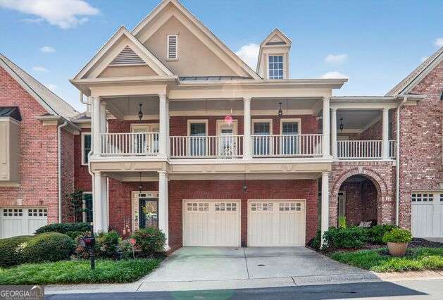 Stunning New Orleans style GATED townhome with an ELEVATOR shaft! This rare floorplan in Ashworth feels like a single family home. Very spacious with an office/living room on the main, banquet size dining room and renovated kitchen opens into the fireside family room with lovely views of the private patio and garden. Lovely kitchen with stone countertops, island, double oven and breakfast bar counter. 10' ceilings throughout the main level, wall of windows along the kitchen and family room and gorgeous hardwood floors throughout. Elegant half bath on the main. The dreamy Owner's suite is truly a gem with a large fireside sitting area, custom walk-in closet and an amazing spa-like bathroom with expansive leather granite countertops, glass frameless shower, jacuzzi tub, glass wall shelves, and stunning iron mirrors! The laundry room is right next door equipped with a washer and dryer. Two more large secondary bedrooms with ensuite bathrooms and walk-in closets. This gated community offers an elevated lifestyle, surrounded by Dunwoody Village with all the new shops and restaurants, Spruill Arts Center, Dunwoody library and close proximity to Perimeter Mall, Marta station, GA 400 and 285. It epitomizes sophistication and convenience. New roof 2020 and new anderson windows 2025!