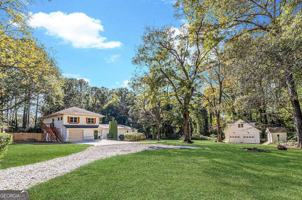 **SELLER SAYS SELL!!** Are you searching for something truly special? This mid-century brick home, nestled on over 2.4 acres, offers a one-of-a-kind experience. With five distinctively themed bedrooms, it's the perfect space for large families who crave room to spread out and enjoy unique character. It also presents an exciting opportunity for savvy Airbnb investors looking to tap into a profitable market! Spanning over 3,200 square feet, this property includes an attached one-car garage and a detached two-car garage, built with a sturdy steel I-beam frame and featuring a spacious loft for additional storage. The detached garage was originally designed to be converted into a carriage house, adding further potential to the property. Inside, you'll find three bathrooms, two kitchens, and two laundry rooms, ensuring convenience for both family living and hosting guests. With three central heating and air zones and two water heaters, year-round comfort is guaranteed. Step into the stunning vaulted mid-century family room, where an abundance of natural light creates a welcoming atmosphere for gatherings of all kinds. Outdoors, the patio and porch offer the perfect spots for relaxation or entertainment. The in-law suite, complete with a separate entrance, boasts two bedrooms, one bathroom, an eat-in kitchen, its own laundry room, and independent heating, air conditioning, and water systems. This property offers endless possibilities garden, farm, add a swimming pool or tennis court the options are only limited by your imagination! And the best part? It's all within the city! Despite its secluded feel, this retreat is just minutes away from Hartsfield-Jackson Airport, Delta HQ, Tyler Perry Studios, Woodward Academy, and the downtown areas of East Point and College Park. With easy access to MARTA, East Point Dog Park, East Point PATH, Arden's Garden, and major highways (I-75/85/285), as well as a short drive to the Atlanta Beltline, this home offers the ideal combination of peace and accessibility. Don't miss out on this incredible opportunity! Whether you're looking for a spacious family home or a lucrative Airbnb venture, this unique property is ready to welcome you.