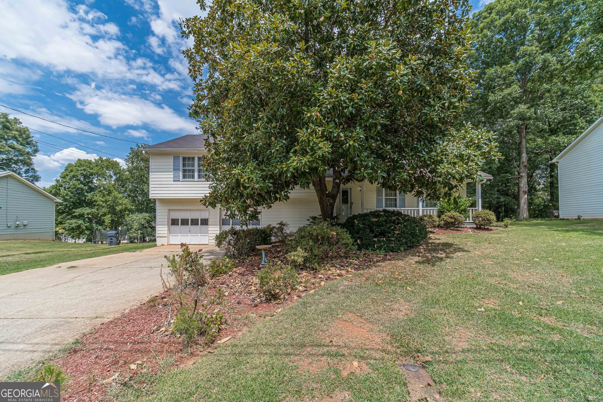 Welcome to this tri-level 3 bedroom, 2 bath home nestled in the heart of Lawrenceville. As you step inside, you'll be greeted by a spacious living area with a cozy fireplace, perfect for family gatherings or quiet evenings at home. The adjacent kitchen boasts ample counter space, well maintained appliances, a breakfast nook and views to the family room.  The dining area offers the perfect space to host family and friends for dinners and gatherings. The upper level of the home hosts the Owners suite and offers a peaceful retreat with a walk-in closet and a spa-like ensuite bathroom. The additional two bedrooms share a full bathroom and offer plenty of room for a growing family or guests. Enjoy your morning coffee on your back deck. The home sits on a nice wooded lot and also features a large backyard, perfect for entertaining and enjoying outdoor activities. Located in a quiet and friendly neighborhood, this home is just a short distance from shopping, dining, and entertainment options. Don't miss out on the opportunity to make this wonderful house your new home. Schedule your showing today!