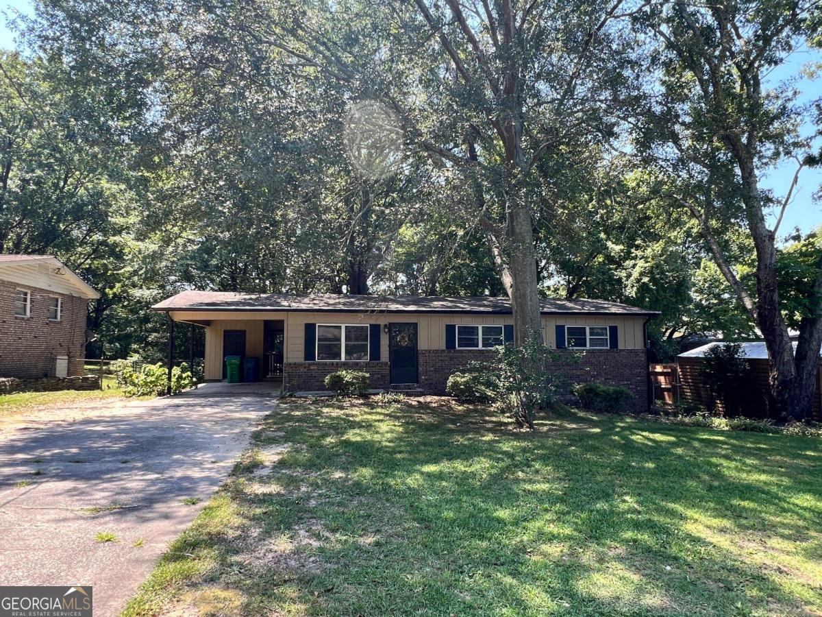 This 3-bedroom, 1-bath ranch home is a great opportunity for first-time homebuyers or investors. It's move-in ready! The property boasts a spacious, fenced backyard with mature trees, providing plenty of outdoor space. Located near major highways 278, 78, and I-20, it offers easy access to local amenities and transportation routes. A solid, no-nonsense investment or a comfortable first home.