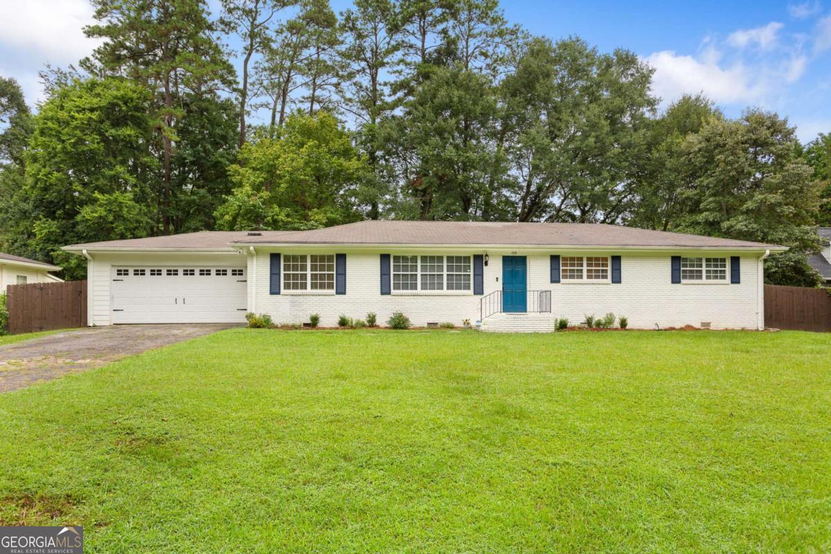 Step into this meticulously refreshed 3-bedroom, 2-bath brick ranch offering 1,620 sq ft of laid-back elegance on a quiet, tree-lined street. With hardwood floors throughout and timeless crown molding, this home radiates charm from the moment you walk in. The spacious, light-filled kitchen is a highlight, featuring granite countertops, sleek subway-tile backsplash, stainless steel appliances, and a cozy breakfast nook. The separate formal dining room offers an elegant backdrop for gatherings large or intimate. Enjoy easy single-story living with a primary suite on the main floor, complete with a beautifully updated bathroom. Both bathrooms are stylishly modern and move-in ready. Nestled in an established, walkable neighborhood, this home offers easy access to the interstate, local parks, walking trails, plus tons of nearby shopping, dining, and entertainment options. Experience all the convenience and character of living in the heart of the action while returning to the peace of a quiet street. Don't miss this updated brick ranch that blends comfort, style, and perfect location!
