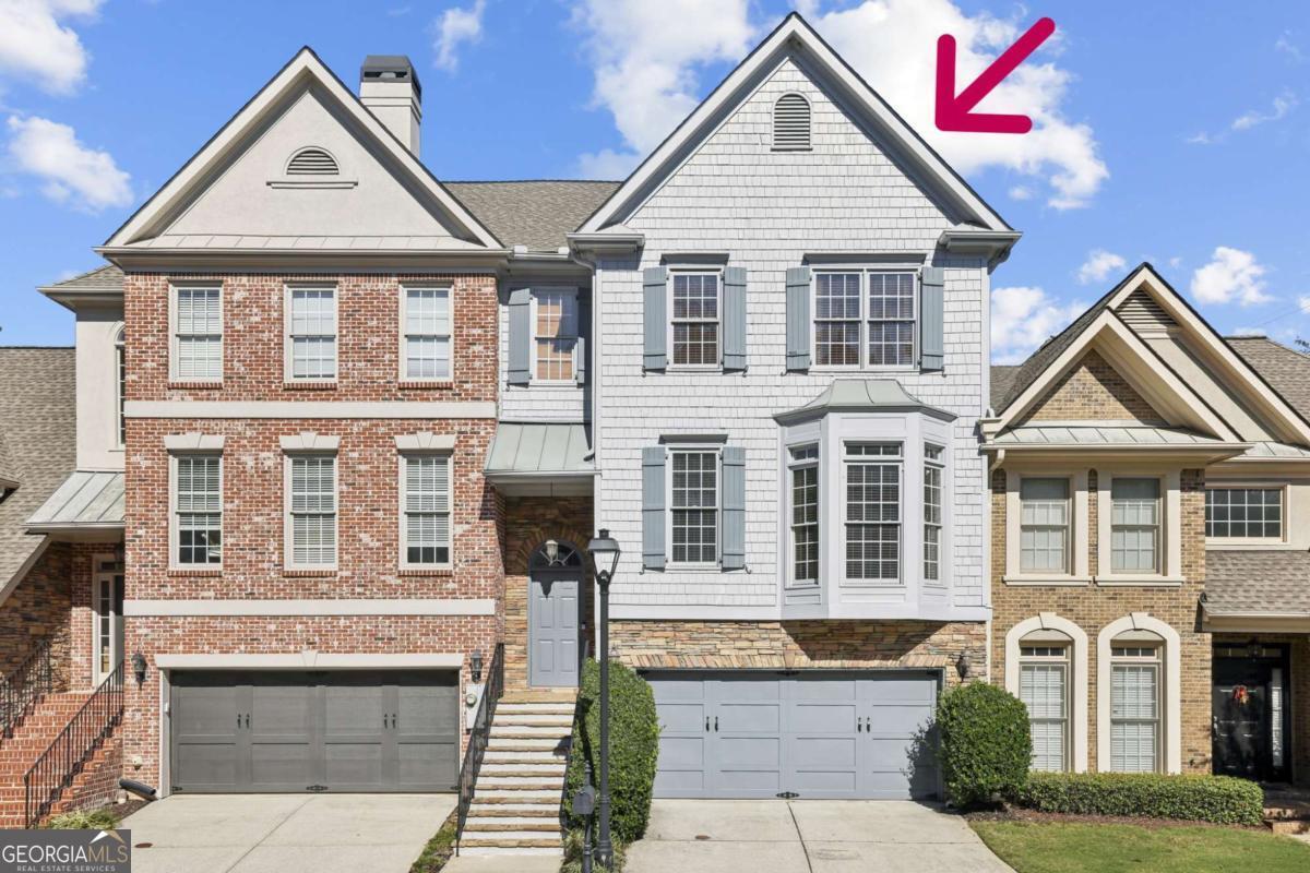 Welcome Home! To this beautifully updated gated townhome located inside the Perimeter (ITP) in Sandy Springs. Perfectly positioned within a small, private gated community, this impeccably maintained 4-bedroom, 3.5-bath townhome with hardwood floors on every level seamlessly blends luxury, comfort, and convenience. Move-in ready and freshly updated, this townhome offers timeless design, modern upgrades, and exceptional functionality throughout its three finished levels. The inviting main level welcomes you with an open and airy layout, featuring a spacious living room centered around a cozy fireplace. The adjoining dining area, complete with a stylish butler's bar, flows effortlessly to the expansive rear deck. This space is ideal for morning coffee, outdoor dining, or evening gatherings under the stars. The beautifully renovated kitchen boasts sleek new countertops, modern cabinetry, and a breakfast bar that comfortably seats four. Additionally, it features stainless-steel appliances, including a double oven, and a bright breakfast area that completes this perfect culinary space. Upstairs, the tranquil primary suite is a true retreat with a tray ceiling and two generous walk-in closets. The renovated primary bath exudes spa-like serenity with dual vanities, elegant lighting, and updated fixtures. Two spacious secondary bedrooms share a designer-renovated bath accented with chic finishes and custom lighting. The fully finished terrace level offers remarkable versatility-complete with a second living area, guest bedroom, and full bathroom. Step outside to your private, fenced backyard oasis featuring an under-deck cover system, creating an inviting all-weather outdoor living space perfect for entertaining or peaceful relaxation. Fresh interior and exterior paint, upgraded lighting, and meticulous landscaping add to the home's refined appeal. Enjoy low-maintenance living and peace of mind within a well-kept gated enclave just minutes from Buckhead, Chastain Park, Brookhaven, and the Perimeter area. Lovingly maintained by its original owner, this exceptional home represents a rare opportunity to experience luxury townhome living in one of Sandy Springs' most desirable locations. We hope you find this townhome as enchanting as we do and look forward to welcoming you to your new home!