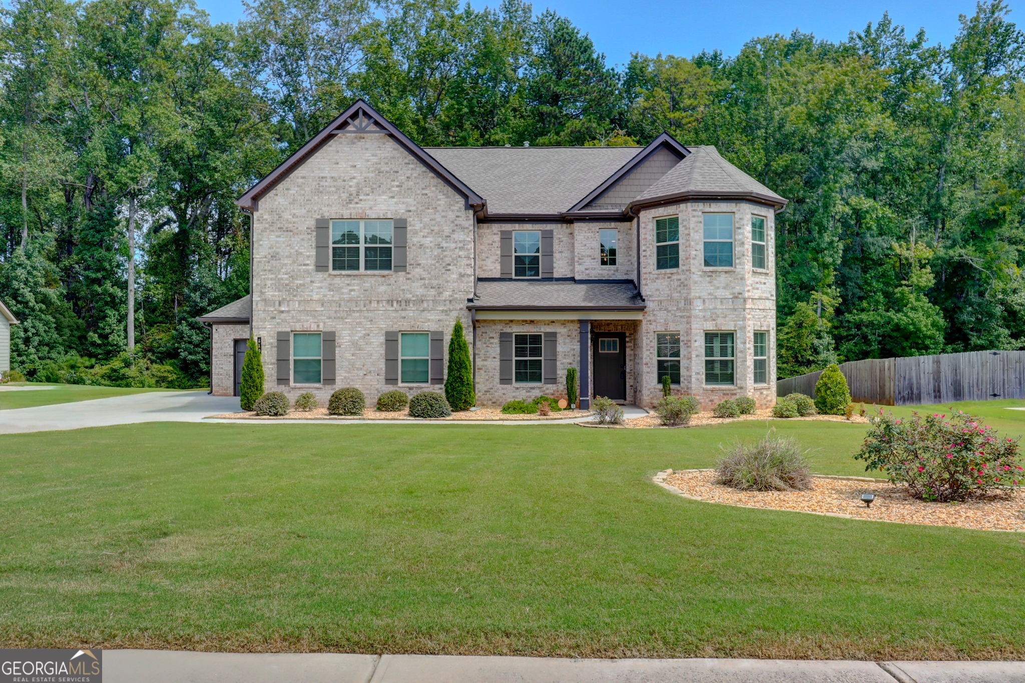 IMMACULATE 5 bedroom 4 full baths home with over 3800+sq.ft located in The Traditions at Crystal Lake subdivision in Hampton, GA! Beautiful touches throughout this home to include new flooring on main level. Step inside this immaculate home that offers upon entry a separate bonus room with French doors from the two-story foyer, Separate living and Formal dining room with coffered ceilings and chair railing just across the hall. Open-concept family room with a cozy fireplace and loads of natural light. Dreamy gourmet kitchen featuring granite counters, a spacious island, on-trend white cabinetry w/ separate office nook with large walk-in pantry. Mud bench area near garage. A full bedroom and bath complete main level, Upstairs, enjoy evenings in the open loft area upstairs! The large owner suite offers separate sitting room with an en-suite bath with dual sinks, granite counters, tub, and separate glassed-in shower. Three more bedrooms on this level share a full bath in hallway and additional full bath exclusive to bedroom. Don't miss the huge backyard with rear covered porch and loads of green space to spread out! This home has it all! Exterior LED solar recess lighting installed around entire home compliments the beautiful curb appeal in the evening and at night! Conveniently located within minutes from the new Publix Shopping Plaza and Jodeco Station with Sprouts, Costco, Target, and a variety of restaurants, shopping and so much more! Let's make this house your NEW HOME TODAY!