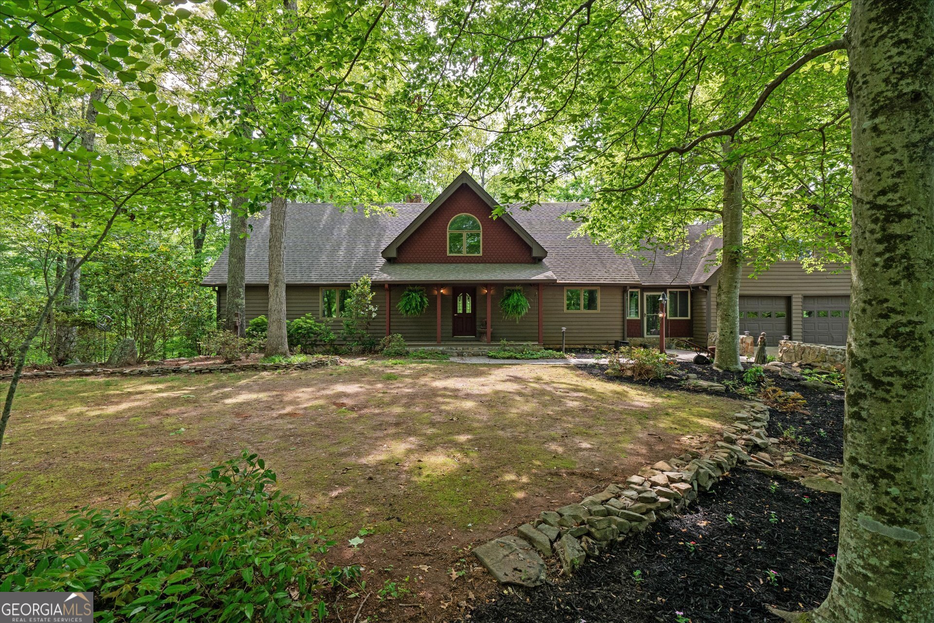 Come experience this luxury, custom estate nestled on 35 acres of fenced pasture and partially wooded land. Split between two separate living quarters, this unique property totals just over 3,900sf with 4 beds and 3.5 baths. (And plenty of space to finish more!) Main home features 2,773 sf with custom, elevated, and rustic finishes. Entering into the open living space, you'll find vaulted ceilings, floor to ceiling windows, rock fireplace, large dining space, and tiled kitchen with tons of cabinetry and updated SS appliances. The oversized Primary Suite sits on the main floor with a floor to ceiling rock fireplace, back deck access, and two story, vaulted ceilings. The backyard is a true oasis featuring stone patios and fire pit, continuous waterfall feature, and outdoor kitchenette suitable for the best entertaining! Down the pasture, you'll find a 40x60 barn with a recently finished 1,200sf upstairs apartment. Barn has ample amount of workshop space and horse stalls. Property is fenced & suitable for livestock. Each living quarter has its own separate entrance and road frontage, and could be divided. Additional 9 acres of woods may be purchased.