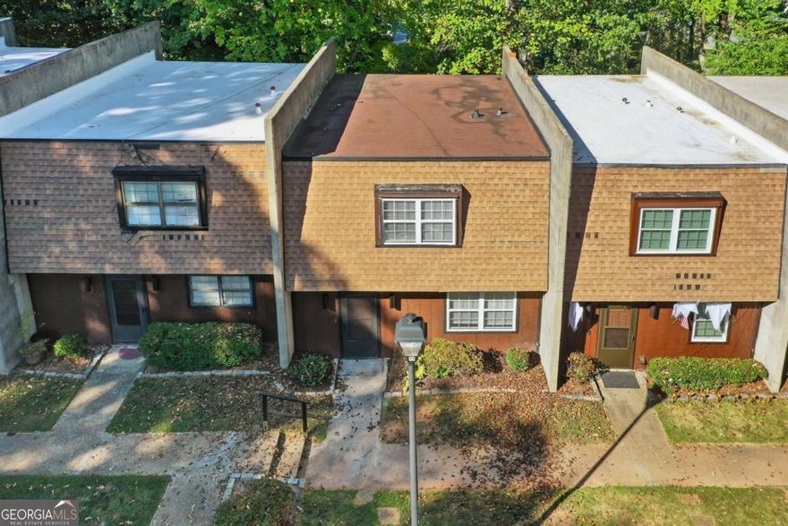 Welcome to this absolutely wonderful townhome, ideally located just minutes from the vibrant Marietta Square. This beautifully renovated 3-bedroom home combines modern updates with timeless comfort, offering a truly move-in-ready lifestyle in one of Cobb County's most desirable areas.    Step inside to discover all-new LVP flooring and a spacious island kitchen showcasing brand-new white cabinetry, gleaming quartz countertops, a stylish tiled backsplash, and new stainless steel appliances. The open layout provides both an eat-in kitchen and a formal dining room-perfect for family dinners or holiday gatherings.    The inviting family room opens to a newly updated rear patio and a brand-new deck, creating an ideal space for entertaining or relaxing outdoors. Upstairs, the generously sized bedrooms feature all-new carpet, and the oversized primary suite includes multiple closets and large windows that fill the space with natural light.    Both bathrooms have been fully updated with beautiful new tile work, new vanities, plumbing fixtures, and lighting-offering a spa-like feel throughout. Every detail has been carefully addressed, including new interior doors, recessed lighting, and stylish new light fixtures. You'll also appreciate the upgraded electrical system with brand-new switches and receptacles throughout the home, providing modern functionality and peace of mind.    Additional upgrades include a brand-new HVAC system, hot water heater, roof, and new windows-ensuring comfort and efficiency for years to come.  Located near Chattahoochee Technical College, Kennesaw Mountain, I-75, and an abundance of shops, restaurants, and entertainment, this townhome delivers exceptional convenience, value, and charm.