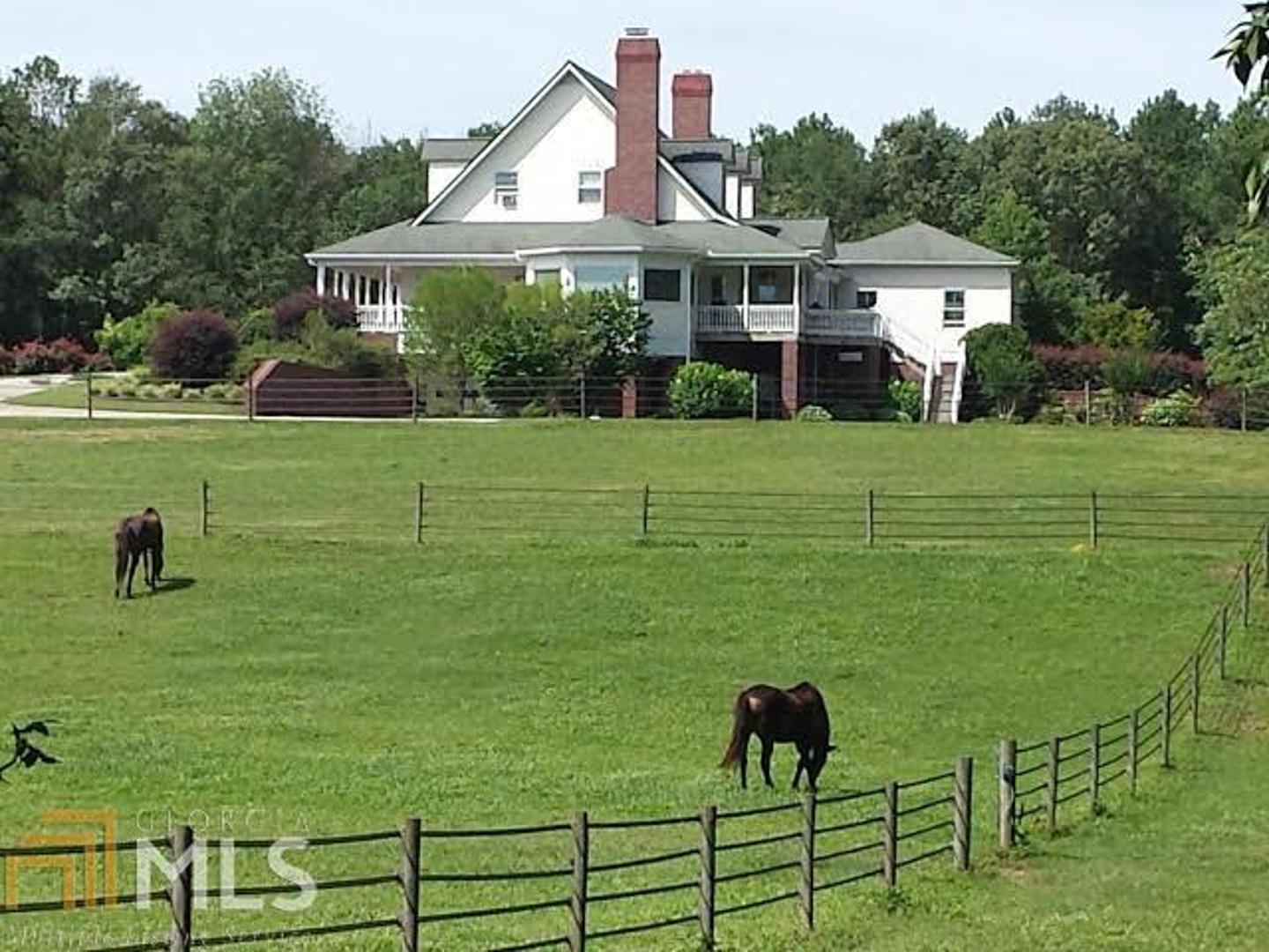 42.48 Ac turnkey gated equestrian estate adjoins 430 ac Ashland Farm with access to their riding program & miles of trails! Easy access to schools, shopping, airports, Atl, Shire & equestrian venues.  Gorgeous 4 BR could be 6, all with en suite baths, Gourmet kitchen, keeping room, solarium, breakfast room, dining room, huge bedrooms verandas, working 8 stall stable w/wash stall, automated spray system, tack & feed room, hay barn, implement barn with 2/1 apartment is perfect for a home business, prof. lighted, sprinkled arena, 35 acres +/- grass fenced & xfenced/double fenced at streets.  Extensive paved frontage two sides. A wonderful family estate, B&B, Home Business, the potential is limitless.  So much here for your money. Sellers say bring all offer!