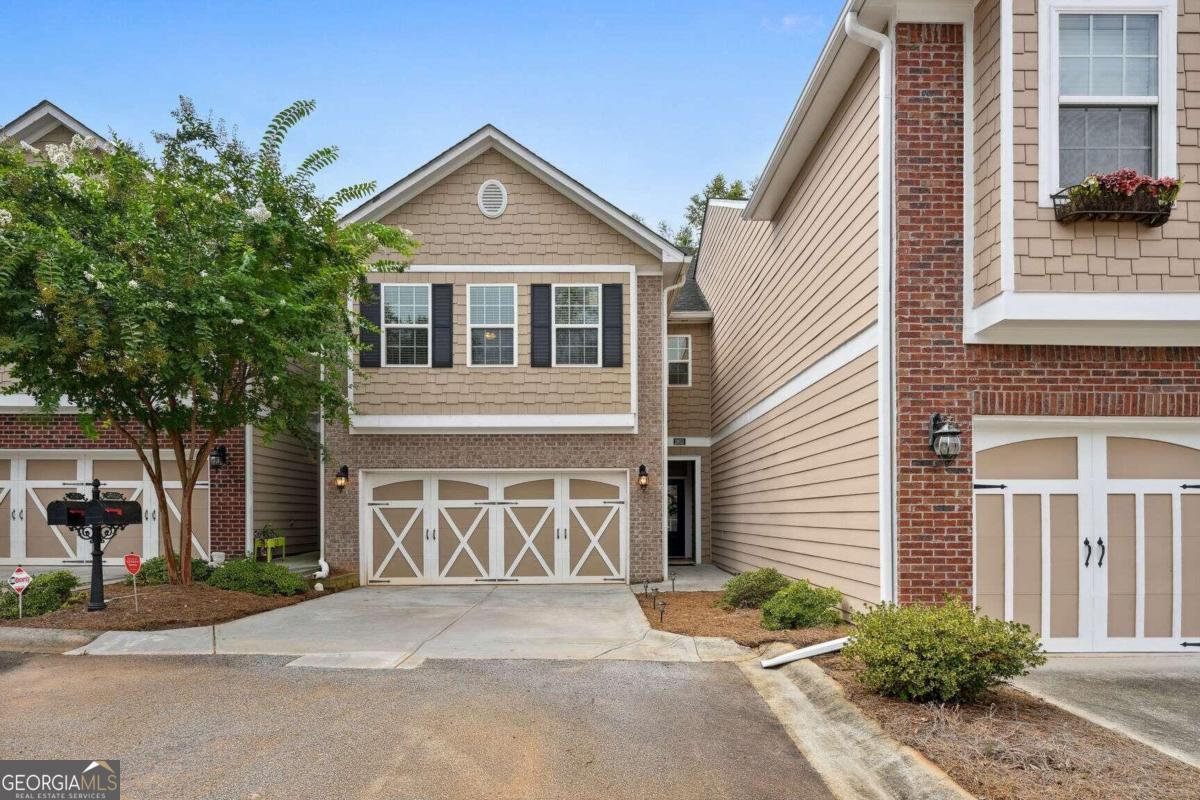 Beautiful and sunny, this charming townhome is nestled within a serene community of just 20 residences. Ideally located for those connected to Emory, CDC, or the bustling midtown/downtown Atlanta area, with easy access to 285. This meticulously maintained townhome features elegant hardwood floors on the main level. The chef's kitchen offers ample workspace, highlighted by a spacious island that serves both as a breakfast table and a gathering spot for casual meals or culinary creations.    Relax in the inviting great room with its picturesque windows, complete with a cozy fireplace perfect for chilly evenings spent binge-watching your favorite shows. Upstairs, a versatile office space awaits, featuring a wall of bookshelves ideal for productivity and focus, or enjoying the newest best-seller. The generous secondary bedrooms share a well-appointed full bath, while the primary bedroom provides ample wall space, a walk-in closet, and a spa-like bath with tasteful tile, separate tub and shower.  Outside, enjoy a private retreat with shaded trees, ideal for relaxing in nature, sipping beverages, or hosting barbecues with loved ones. This hidden gem is just minutes from Emory Decatur Hospital, excellent shopping, dining options, and the vibrant Decatur square. Escape the hustle and bustle as you arrive home, park in your garage, and unwind in this peaceful enclave while still enjoying all that the city has to offer. Welcome to your new home!