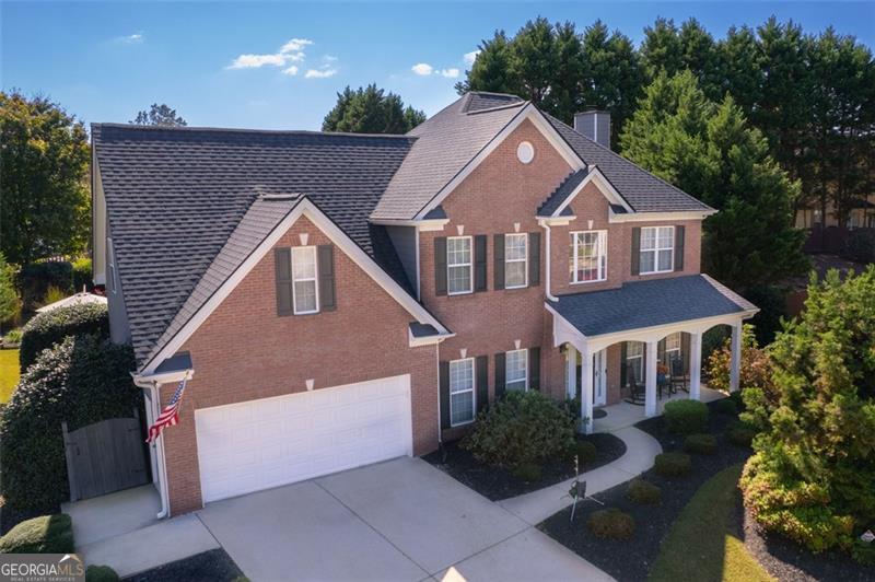 Located in the desirable Ivy Green community, this 4 bedroom, 2.5 bath home offers nearly 2,900 square feet of updated living space and a rare combination of resort-style outdoor amenities, thoughtful interior improvements, and access to one of the most sought-after areas in North Georgia. The owners have invested significantly in both structural and cosmetic upgrades. In August 2022, the roof was replaced and the entire exterior was updated with new siding and fresh paint, giving the home a clean, modern presentation. Inside, full interior repainting extends throughout every room, and last year, CYRUS Everlife waterproof LVT flooring, a rigid core product with a lifetime warranty, was installed across the entire home for durability and style. The main floor begins with two versatile flex rooms at the front of the home, traditionally used as formal living and dining spaces but easily adapted as offices, playrooms, or hobby areas. Toward the back, the home transitions into a true open-concept layout, with the kitchen flowing directly into the breakfast area and family room. Just beyond is a fully enclosed screened-in porch, finished as an additional living room with ceiling fans, seating space, and a mounted TV for year-round enjoyment. Outside, the backyard functions as a private retreat. The saltwater (saline) pool has been meticulously maintained, featuring a PebbleTec liner, a new pump motor installed in 2024, and a brand new automatic pool rover for effortless upkeep. While the pool is not currently heated, all plumbing infrastructure-including a dedicated concrete pad-is already in place for an easy future heater installation. With multiple lounge and dining zones surrounding the pool, the outdoor living area becomes a natural extension of the home, perfect for birthdays, summer gatherings, and peaceful evenings that last long into the night. Upstairs, the oversized primary suite features a private sitting nook and direct access to the en-suite bath and walk-in closet. Three additional bedrooms provide flexibility for family, guests, or work-from-home needs. Zoned to Harmony Elementary, Glenn C. Jones Middle, and Seckinger High School, residents benefit from access to top-performing Gwinnett County schools, including Seckinger's AI and STEM-focused programs. Additionally, with proper proof of residency through City of Buford utilities, families have the option to pursue enrollment within the City of Buford School System, giving this address unique educational flexibility. The Ivy Green community further enhances the lifestyle with a neighborhood pool, tennis courts, playground, and peaceful walking trails along Ivy Green Creek. It's the kind of neighborhood where kids play outside, neighbors wave from porches, and families stay for years. More than just a well-maintained home, this property offers true Buford living, with access to top-tier Gwinnett County schools and proximity to Buford City opportunities - the lifestyle so many families move here for.