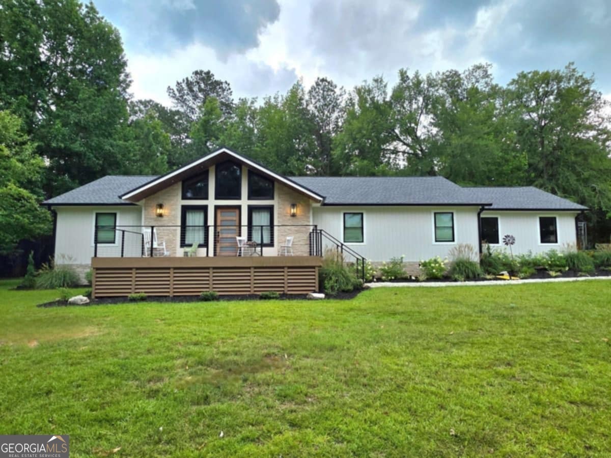 Welcome to this beautifully updated 3-bedroom, 2-bath home on over 3 private acres in an established, highly sought-after neighborhood-just off Riverside Drive and only 5 minutes from Bass Road. Enjoy peaceful living with quick access to shopping, dining, and I-75. Located in the Monroe County School District-one of the top-rated school districts in Georgia-this home offers the perfect blend of style, space, and location. Features include: Brand new roof, Board and batten siding, Spacious front porch with tongue-and-groove ceilings Inside, you'll love the open layout filled with custom finishes. The kitchen features quartz countertops, high-end appliances, and a wet bar with wine cooler-perfect for entertaining. The primary suite feels like a retreat, with a tiled walk-in shower, freestanding soaking tub, and floating vanity with gold accents. The second bathroom is just as stylish with modern tile and designer details. Other highlights: Stone fireplace, Custom dog-wash station Quiet setting. Top schools. Move-in ready. Schedule your private tour today!