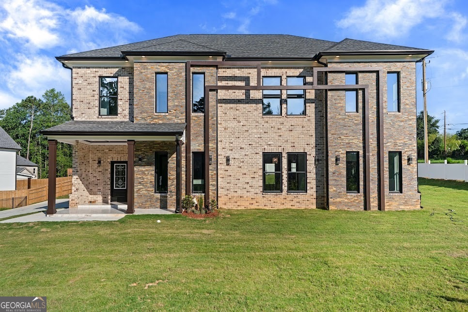 **BUILDER'S and LENDER INCENTIVES AVAILABLE ** Discover the perfect blend of privacy and elegance in this brand-new luxury home at 1515 Grayson Parkway. Nestled outside the neighborhood but yet not completely secluded, this residence offers the best of both worlds: peaceful living with convenient access to all that Grayson and Gwinnett County have to offer, all with no HOA restrictions. The dramatic double-height living room sets the tone with a grand chandelier and a striking fireplace, creating a captivating focal point. Throughout the home, custom light fixtures and fine detailing add character and charm, while the formal dining room and bedrooms boast Plaster of Paris ceiling accents that elevate the design to true luxury. The chef's kitchen is equipped with granite countertops, a built-in wall oven and microwave unit, and a seamless flow into the living and dining spaces. A main-level bedroom offers flexibility for guests or multi-generational living, while the open second floor overlooks the living and dining areas, flooding the home with light. The owner's suite is a retreat of its own, featuring a spa-inspired bath with a rain shower and state-of-the-art fixtures. With tiles throughout, elegant finishes, and meticulous craftsmanship, this home delivers both sophistication and durability. This residence is not only a home but a statement of modern luxury, private, connected, and designed to impress. Offered at $859K, this new luxury residence is thoughtfully priced to reflect both its craftsmanship and today's market, making it an exceptional opportunity in Grayson.