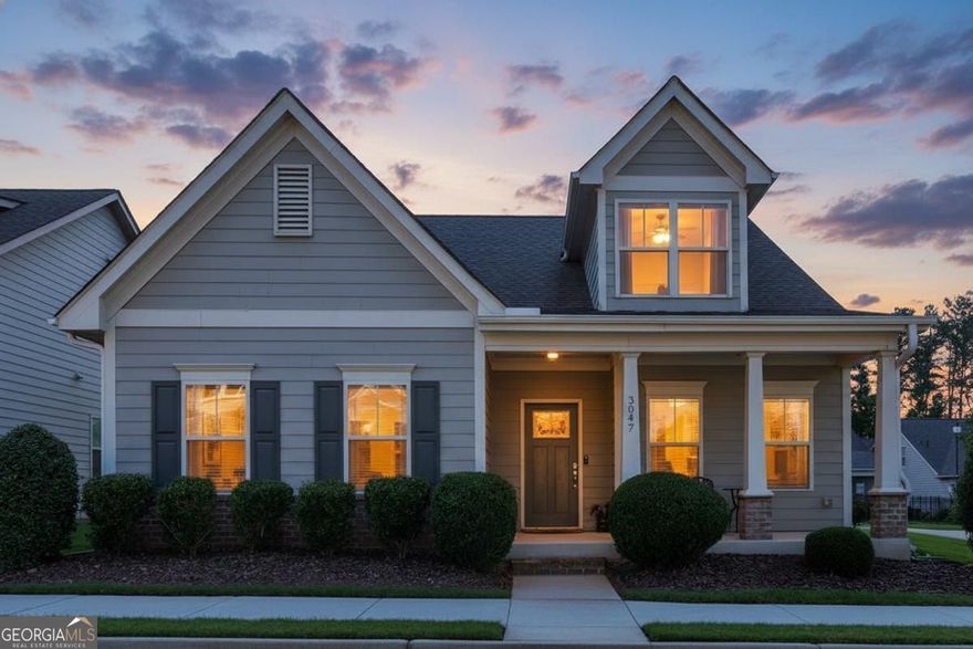 Live the lifestyle you deserve in this stunning craftsman-style home inside Marietta's premier active adult gated community. Designed for comfort, convenience, and connection, this home pairs modern luxury with a vibrant social setting just minutes from the Marietta Square and the Silver Comet Trail.  Step inside and be wowed by soaring ceilings, crown molding, and an open-concept design that's perfect for entertaining. The great room features a cozy fireplace and flows seamlessly into the gourmet kitchen, where granite countertops, designer cabinetry, stainless steel appliances, and an oversized island set the stage for gatherings.    The main-level owner's suite is a true retreat with wood beam accents, spa-inspired bath, dual granite vanities, oversized shower, and a walk-in closet. A private guest suite with en-suite bath adds comfort and privacy. Upstairs, a versatile flex space, third bedroom, and full bath give you room for guests, hobbies, or a home office.  Enjoy the sun porch, two-car garage, and low-maintenance living with lawn care included. Community perks include a clubhouse, outdoor seating areas, guest parking, and year-round social events. Even better, the pool table and accessories are included, and with an acceptable offer, furnishings may remain for a seamless move.  This is more than a home, it's an elevated lifestyle in one of Marietta's most sought-after active adult communities.