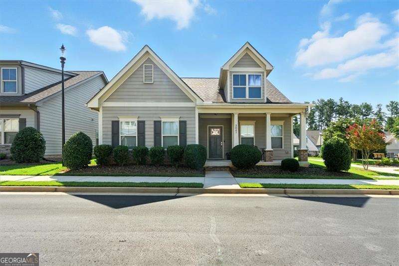 Live the lifestyle you deserve in this stunning craftsman-style home inside Marietta's premier active adult gated community. Designed for comfort, convenience, and connection, this home pairs modern luxury with a vibrant social setting just minutes from the Marietta Square and the Silver Comet Trail. Step inside and be wowed by soaring ceilings, crown molding, and an open-concept design that's perfect for entertaining. The great room features a cozy fireplace and flows seamlessly into the gourmet kitchen, where granite countertops, designer cabinetry, stainless steel appliances, and an oversized island set the stage for gatherings. The main-level owner's suite is a true retreat with wood beam accents, spa-inspired bath, dual granite vanities, oversized shower, and a walk-in closet. A private guest suite with en-suite bath adds comfort and privacy. Upstairs, a versatile flex space, third bedroom, and full bath give you room for guests, hobbies, or a home office. Enjoy the sun porch, two-car garage, and low-maintenance living with lawn care included. Community perks include a clubhouse, outdoor seating areas, guest parking, and year-round social events. Even better, the pool table and accessories are included, and with an acceptable offer, furnishings may remain for a seamless move. This is more than a home, it's an elevated lifestyle in one of Marietta's most sought-after active adult communities.