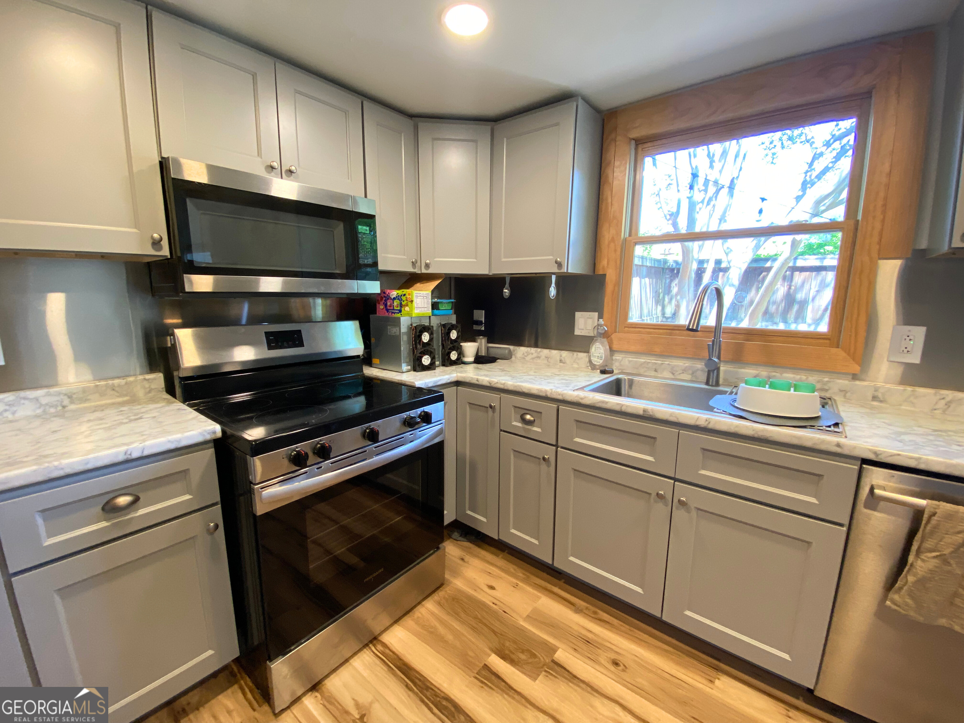 Looking for a comfortable, updated place to call home? Come see this inviting unit in the Summit Chase complex, conveniently located just off South Milledge Avenue! The kitchen has been recently renovated with modern appliances, new cabinets, and sleek countertops- perfect for anyone who loves to cook or entertain. Sliding glass doors off the kitchen lead to your own private, fenced backyard where you can enjoy the sunshine and relax after a long day! Downstairs features brand new LVP flooring throughout, plus built-in shelving for extra storage or display. Upstairs, both bedrooms offer vaulted ceilings and plenty of closet space. Upstairs carpet is brand new, so everything feels fresh and clean. The full bathroom includes a double-sink vanity, a walk-in shower, and a separate tub! This unit combines comfort, convenience, and style- schedule a tour today and see if it's the right fit for you! Tenant responsible for all utilities- trash and pest control is included in the rent. Pet policy: Dogs ONLY with non-refundable $300 pet fee per pet.