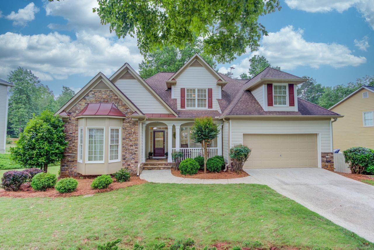 Back on the Market!! This elegant 5 bed 3 bath home is located in an upscale neighborhood with a community swim and tennis, walking trails, and close enough for kids to walk to school. Inside you will find a spacious living room with palatial two story windows and gas fireplaces opening to the inviting breakfast nook and roomy kitchen. Includes a large dining room and office on the main with beautiful deck overlook. This gorgeous home boasts of a private roommate floor plan with the master-on-main and three more bedrooms upstairs with their own bath, and massive walk-in storage space. The walkout basement (with separate entrance) contains an Apartment including a second spacious kitchen, large bedroom and bath with double vanity, separate office/6th functional bedroom, formal dining room, additional laundry, living room with lots of natural light, and covered screened-in porch overlooking the private and fenced back yard. The backyard is beautifully wooded and creates privacy for all to enjoy. This home is perfect for families...or those who love family and friends to just visit for a while, and it makes all who enter feel welcome. It won't be on the market for long! Schedule your viewing TODAY!!