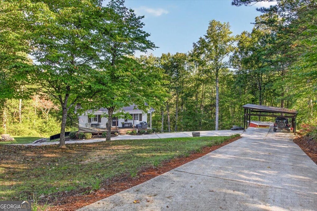 Photo of 1015 Shamrock Lane, Ball Ground, GA 30107 (MLS # 10868332)