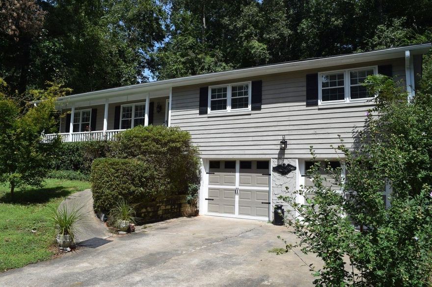 Location! Location! Convenient to Roswell, Alpharetta, and Canton this Updated Raised-Ranch sits on a full half-acre with basement. Sunroom and Laundry were added off Kitchen plus a nice sized room finished in the basement for your office, home gym, man cave, craft room, etc. Stainless Appliances, Established Landscaping, and in a wonderful neighborhood in the Sequoyah High district.