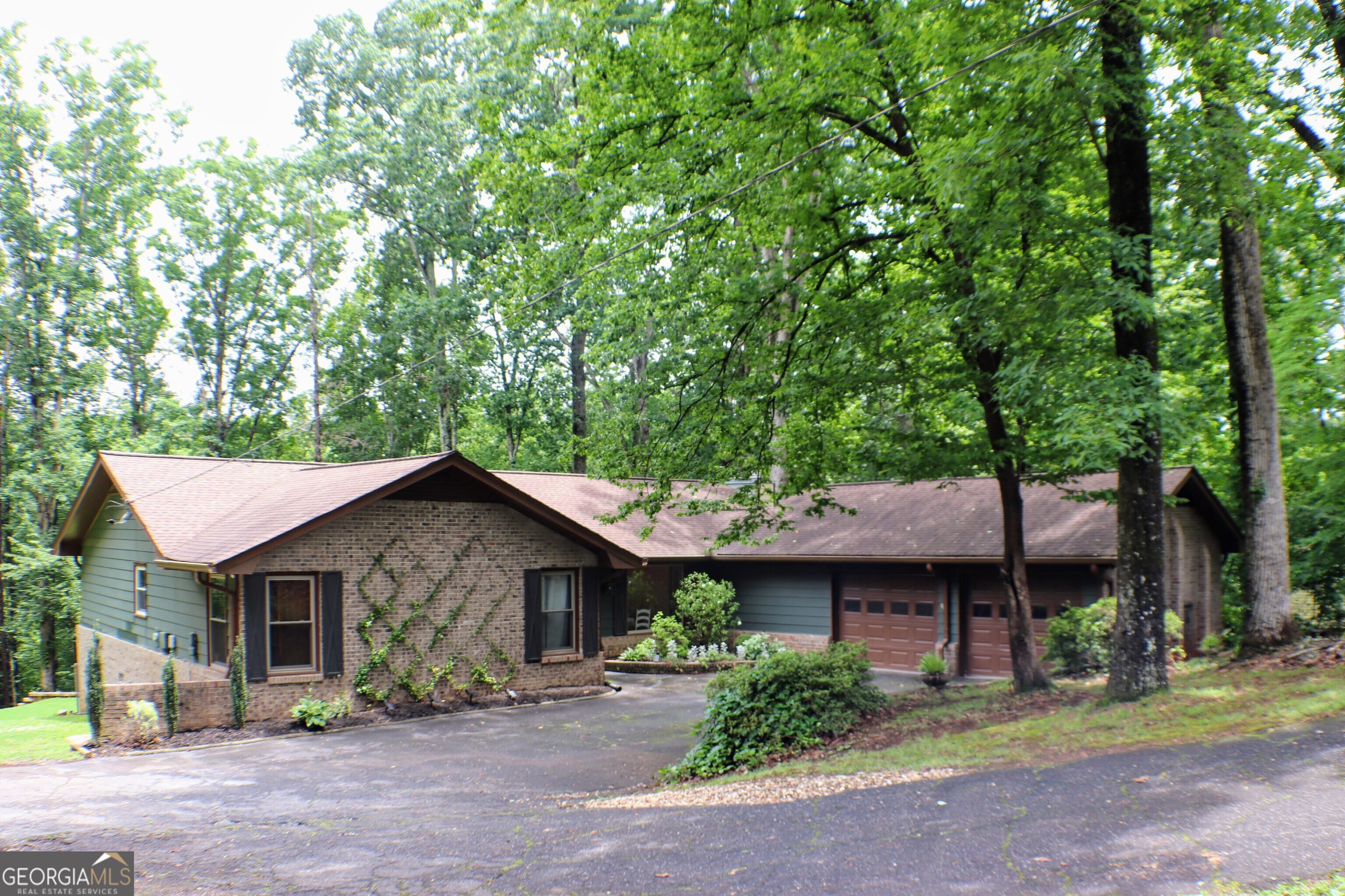**You MUST SEE!** Welcome to this spacious 3-bedroom front-brick beauty, nestled under a canopy of mature trees in the serene and relaxing river view. Situated in a highly desirable and established neighborhood, this meticulously maintained traditional home provides a comforting oasis. From the moment you step through the welcoming foyer, you'll feel right at home! Inside, enjoy generous living areas with warm, cozy details enhanced by the relaxing view and sound of the river. Whether it's family dinners in the separate dining room, morning coffee in the sunroom, or creating memories next to one of the two brick-encased fireplaces, you'll find the perfect space for every occasion. The eat-in kitchen features plenty of natural light from the window, a breakfast bar, surrounded by U-shaped granite countertops and stainless steel appliances, including an optional French door refrigerator located in the garage. Adjacent to the kitchen is a spacious laundry room equipped with ample cabinets and storage. From the family room and laundry room, you can access your new deck and backyard oasis! And what about the outdoor space? It's a hidden gem featuring a wood-burning fireplace (fire pit* not included), providing the ideal setting for entertaining or relaxing under the trees while taking in the views of the river. The lot offers privacy, shade, and plenty of room to roam or unwind. This home combines timeless character with thoughtful updates, offering endless potential and comfort.