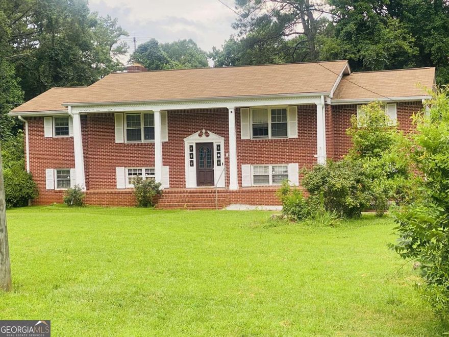 Bring This Stately Beauty Back to Life!    Estate-owned and full of potential, this classic four-sided brick property is waiting for the right buyer with vision to restore its former glory. Nestled on 3.3 private acres with no HOA restrictions, this solid home offers endless possibilities for someone ready to create something truly special.    Currently holding a special use permit as a transitional home (formerly a school), the property boasts spacious interiors with plenty of room to reimagine its layout. Imagine enjoying serene evenings on the screened-in back porch, surrounded by mature trees and ultimate privacy.    Please note: This property cannot be used as a primary residence without county approval due to its current special-use designation.    All current furnishings convey, giving you a head start on transforming this property into your dream estate, creative retreat, or unique business opportunity.    Opportunities like this are rare-a stately property with land, privacy, character, and limitless potential. Bring your ideas and breathe new life into this remarkable piece of real estate.    Property is currently occupied. Property is sold "As Is". Schedule through ShowingTime.  Preferred Attorney, Chris Little of Parkway Law Group. You'll love  working with a cooperative and professional listing agent who's committed to getting the deal DONE!