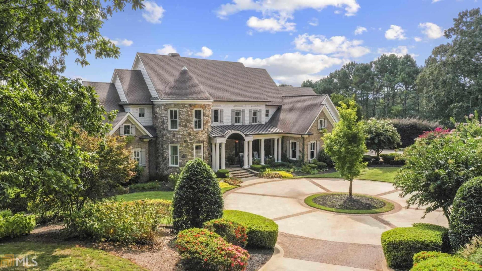 Private, custom built estate home situated on 21.9 acres in a prime Milton location. The property made up of green pastures and wooded areas to protect it's privacy, is completely fenced with 4 board fencing and has a gated entrance. This home, with architectural details throughout and over 7,000 sq ft, is an entertainer's dream with an open floor plan and great indoor and outdoor living spaces. The main level consists of an entry way with a barrel ceiling and foyer with a marble floor inlaid decorative motif* the owner's suite which includes a breakfast bar, large custom closet, luxurious spa, sitting area with marble fireplace, and a private porch overlooking the property* a large dining room for entertaining guests* gentleman's study with a fireplace and coffered ceiling* a living room with stone fireplace and soaring high coffered ceiling that opens to an outdoor covered veranda with fireplace that overlooks the pool and scenic views of the pastures with a wooded backdrop* chef's kitchen with top of the line appliances with an adjoining second/prep kitchen* and a one of a kind family room with full bar and floor to ceiling stone fireplace. The second level hosts 3 secondary, ensuite bedrooms, all with their special design and features. Semi-finished basement. Additional structures on the property include an updated 2 bedroom guest home and a 4 stall barn.