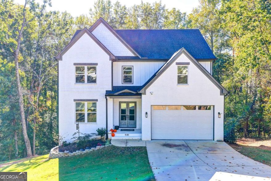 Welcome to 6181 Shoreland Circle, a beautifully maintained home located in the highly sought-after Buford area! This spacious property offers a perfect blend of comfort, style, and location. Featuring 4 bedrooms and 3 bathrooms, the home includes an open-concept living area, a bright kitchen with modern appliances, and a cozy family room with fireplace. The owner's suite offers a walk-in closet and a private bath with double vanities and a soaking tub. Step outside to enjoy a large, fenced backyard ideal for entertaining, relaxing, or family fun. Conveniently located near Lake Lanier, shopping, dining, parks, and top-rated Buford City Schools. Easy access to I-985 and I-85 makes commuting a breeze. This is a must-see home in a quiet, established neighborhood schedule your showing.This exceptional home offers an expanded back porch that seamlessly blends comfort and elegance, overlooking serene natural surroundings. Just a few steps from your backyard, enjoy private lake access the perfect retreat to relax, entertain, and take in the beauty of nature from the comfort of your own home.!