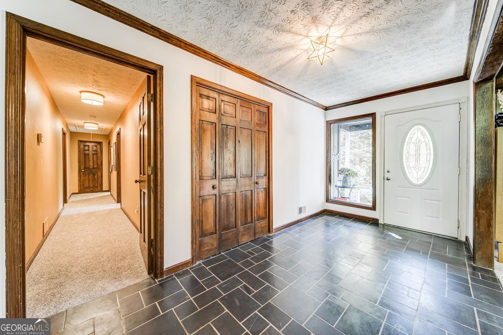 Photo of 4587 Town Crier Road SW, Lilburn, GA 30047 (MLS # 10717900)