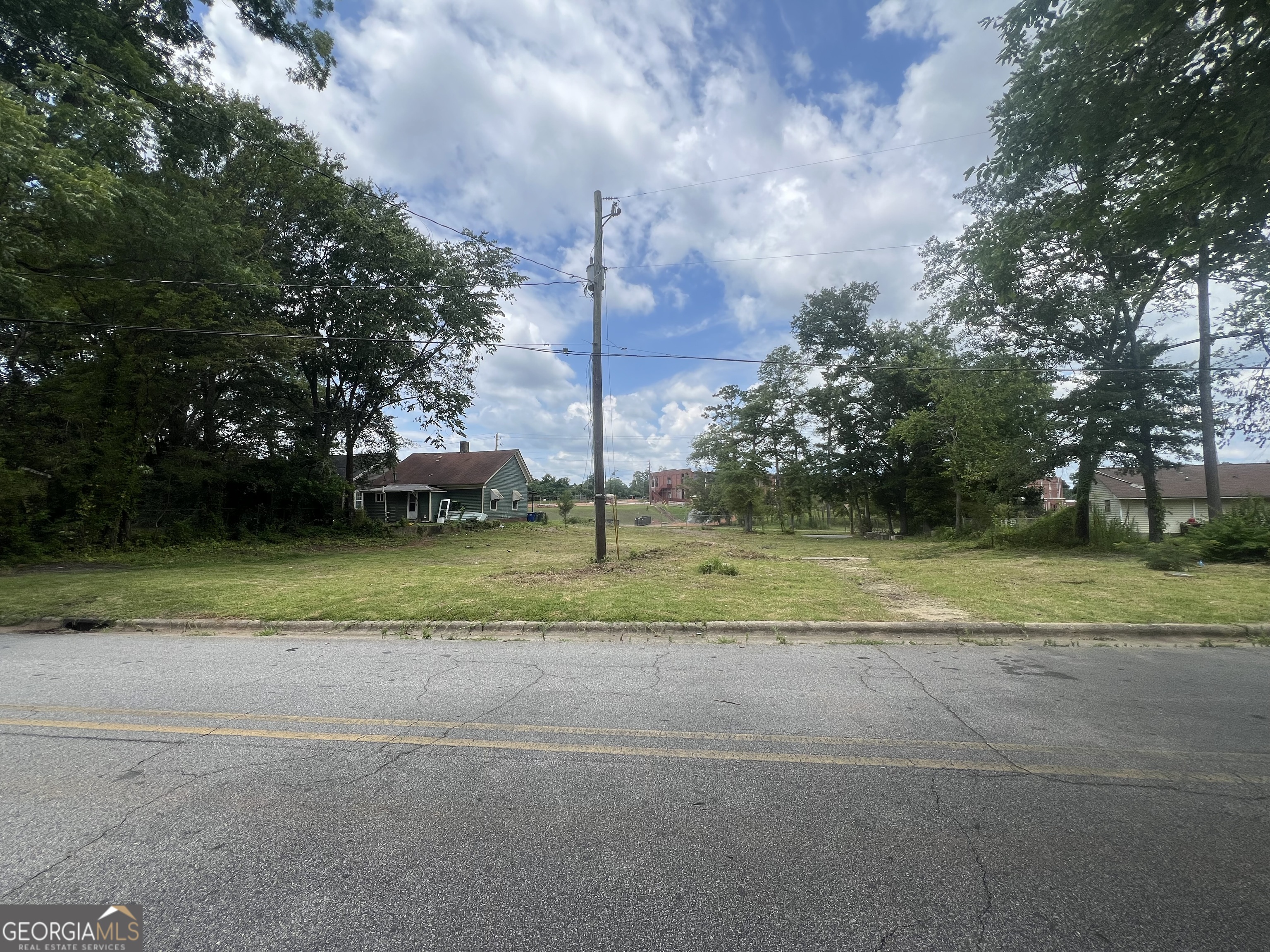 LAND HAS BEEN CLEARED! Prime land lot in Griffin, GA! This nearly half-acre leveled lot is the perfect spot to build your dream starter home. The property is already equipped with utilities on site, including water and electricity, saving you time and money. Located just minutes away from downtown Griffin, you'll enjoy the convenience of nearby amenities while nestled on a quiet street. The lot has been cleared, with only minor debris remaining, making it build-ready for your vision. Don't miss this fantastic opportunity in a peaceful neighborhood!