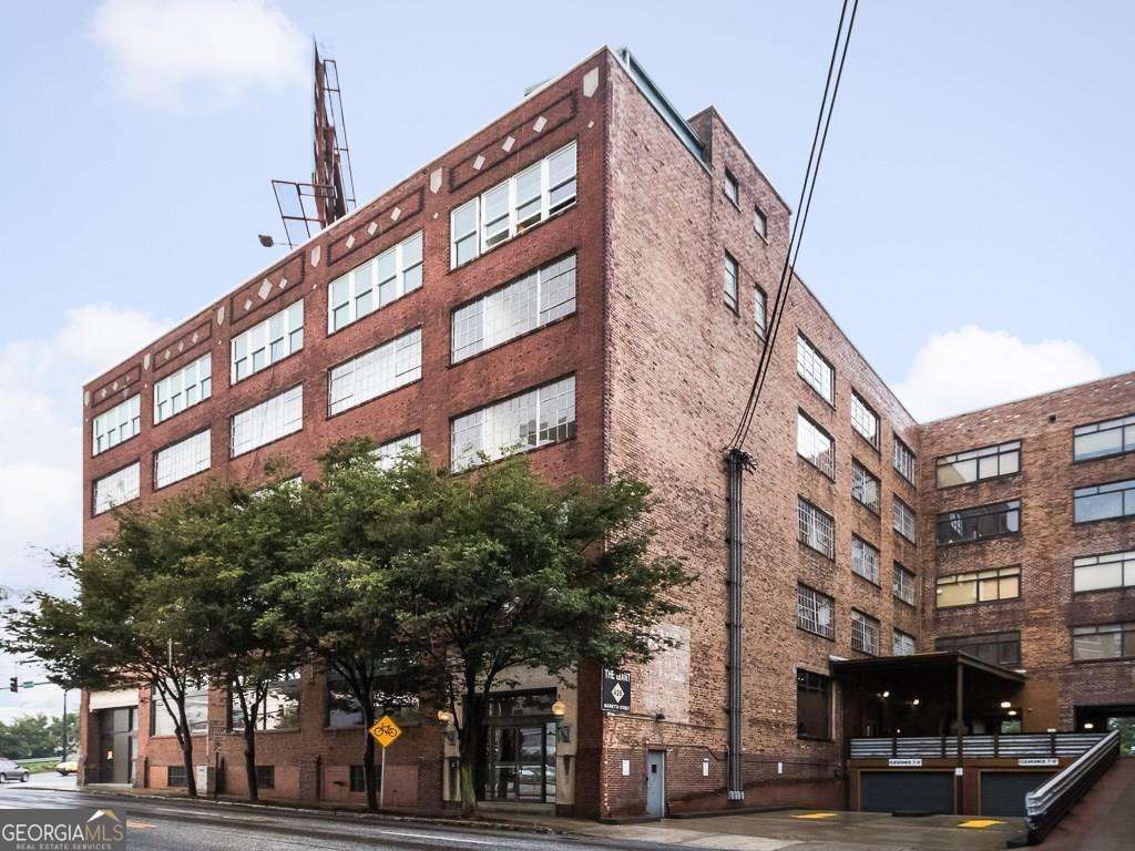 Authentic Loft in the heart of Downtown Atlanta ! Tons of light and views of the Mercedes Benz stadium and City views. The building is listed on the National Register of Historic Places -- it was built in 1910. Oversized space w/12 12-foot ceilings, concrete construction and floors, exposed brick walls, a kitchen with a breakfast bar, and a laundry room in the unit. Master bedroom with a walk-in closet and a large bath. Gated underground parking with elevator access to the secured building. Spectacular rooftop deck. NOTE - A second bedroom w/closet can easily be added. Easy walking distance to The Center (formerly CNN center), Centennial Olympic Park, & more.