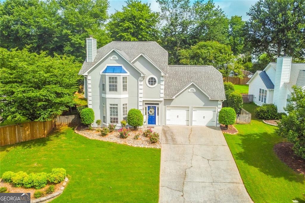 Located at 655 Ruxbury Court in the desirable Suwanee, Georgia, this attractive property presents an exceptional residential opportunity. Enjoying great condition, this home offers a harmonious blend of comfort and style. The living room offers an inviting atmosphere, highlighted by a fireplace, tray ceiling, and crown molding. Envision evenings spent in this welcoming space, where the fireplace creates a warm glow and the architectural details add a touch of sophistication. The updated kitchen is equipped with a backsplash, stone countertops and a kitchen breakfast bar. The design offers both functionality and aesthetic appeal. This single-family residence features four bedrooms and two and a half bathrooms, providing ample space for comfortable living, with a total living area of 2346 square feet. This property offers a blend of classic design and modern convenience. With its desirable features and prime location, this Suwanee residence is poised to become your personal haven.