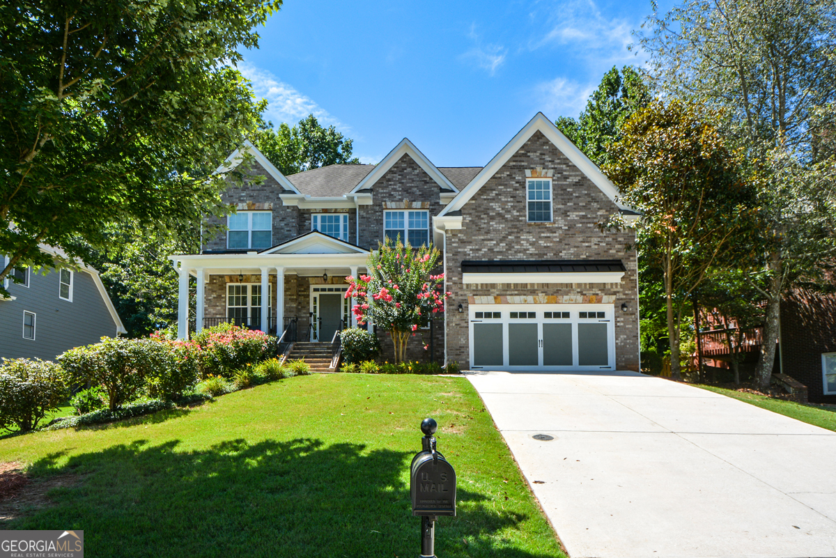 Nestled in a quiet, well-maintained neighborhood, this 6-bedroom, 5-bathroom brick beauty offers a rare combination of space, style, and location. Boasting over 5,000 square feet of finished living space, including a completely finished basement, this home has been thoughtfully designed and meticulously maintained - move-in ready and loaded with premium upgrades. From the moment you arrive, you'll be impressed by the home's classic curb appeal, with its stately brick facade, welcoming front porch, manicured landscaping, and carriage-style garage doors. Inside, you'll find granite countertops, high-end trim work, and quality finishes throughout, creating a refined yet comfortable atmosphere. The main level features hardwood flooring, an open-concept kitchen with granite counters, a large island, and ample cabinet space - perfect for hosting gatherings or enjoying family meals. The kitchen flows seamlessly into a spacious family room filled with natural light and centered around a cozy fireplace. You'll also find a separate formal dining room and a main-level guest suite or office, offering flexibility for your lifestyle needs. Upstairs, the oversized primary suite includes a luxurious en-suite bathroom with dual vanities, a soaking tub, and a separate shower. The secondary bedrooms are generously sized with great closet space and access to well-appointed bathrooms. The fully finished basement adds incredible value, providing versatile space for a home theater, gym, playroom, or in-law suite - complete with its own full bathroom and separate entrance option. Located in a highly desirable area of Powder Springs, this home is just minutes from parks, shopping, dining, and top-rated schools, while still offering a quiet suburban feel. Whether you're looking for room to grow or space to entertain, this home checks every box.