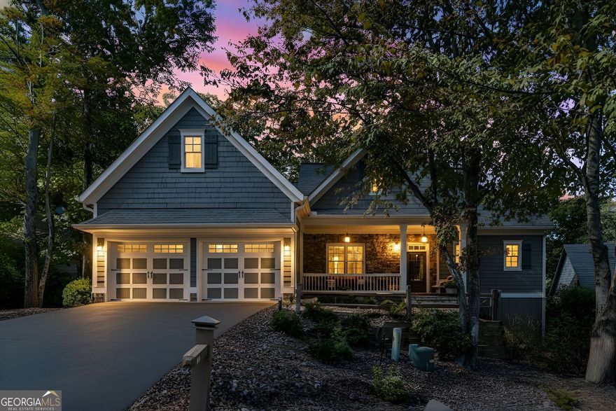 Escape to Big Canoe - North Georgia's premier gated mountain and lake community, just one hour from Atlanta and 45 minutes from Avalon in Alpharetta. Nestled in Hillside at Cox Mountain, the only non-rental neighborhood in Big Canoe, this move-in-ready home offers the perfect blend of luxury, low-maintenance living, and resort-style amenities.  This fully renovated 3-bedroom, 4.5-bath home showcases modern design and mountain comfort. The light-filled great room features vaulted ceilings, a stone fireplace, and views of 12 acres of protected woodlands that will never be developed. The gourmet kitchen, renovated in 2025, is ideal for entertaining family and friends and includes a large island, quartz countertops, stainless appliances, workstation sink, and custom cabinetry.  The primary suite on the main level is a serene retreat with a spa-style bath, featuring a freestanding soaking tub, frameless glass shower, and custom closets. Upstairs, you'll find two ensuite bedrooms, a loft, and flex space perfect for guests or a home gym. On the terrace level, enjoy a full entertainment suite with a bar, wine storage, fireplace, and private home office for easy work-from-home convenience (could be easily converted to 4th bedroom).  Relax outdoors year-round with two screened porches and a welcoming front porch. A flat driveway, new roof, fresh paint, updated lighting and flooring make this a true turnkey home.  Living in Big Canoe means access to incredible amenities: 27-hole championship golf course (no initiation fee), multiple lakes for fishing, kayaking, and boating, beach and swim area, marina, pickleball, tennis, racquetball, and bocce courts, wellness and fitness center with classes, indoor pool and gym, over 100 clubs and social activities for every interest, gated security, paved roads.  This home is two minutes from the clubhouse, pro shop and wellness center, six minutes from the main gate, and is ideal for anyone searching for a primary residence or second home close to Atlanta where golf, fitness, hobbies and nature come together in one exceptional community.  Experience the best of North Georgia mountain living with resort amenities, modern comfort, and peaceful privacy.