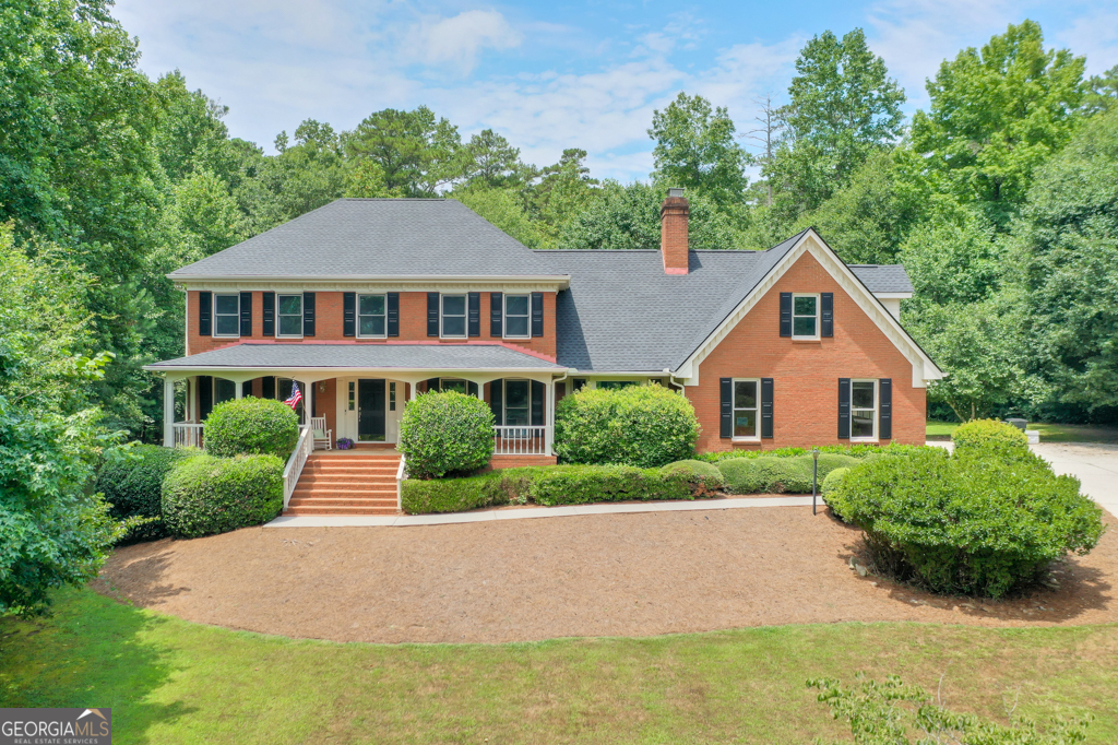Welcome to this wonderful home in sought-after Riverclilff Trace Subdivision. This four-sided, custom built traditional home with finished basement/terrace level is situated on 1.98 acres of land. The home still has many of the original quality features and is ready for your personal touches and upgrades. The front of this home offers an impressive entrance with a large front porch and you are greeted with warmth as you enter. This lovely home was built with thoughtful design and quality to ensure that it created the best of everything for the owners. As you move through the main living areas, natural light beams through the large windows and offers beautiful views of the landscaped seasonal backyard. The large kitchen is well-appointed for your culinary needs and offers ample cabinet and counter space, two (2) pantries, wet bar, built-in desk and the adjacent formal dining room is the perfect space for enjoying those home prepared meals. Next to the kitchen is a large breakfast area with access to the expansive rear deck and a timeless brick floor screened porch is accessed from the family room. Both of these outdoor living spaces are perfect for entertaining family and friends, enjoying your morning coffee or sipping a glass of iced tea while watching deer stroll by, listening to the birds or star-gazing in the night sky. Wooded backyard offers a great space for outdoor activities, gardening or simply relaxing. The main level of the home also offers a formal living room, office/bedroom, full bathroom and family room with a brick fireplace and built-in shelving. The family room provides a calming space to enjoy the fireplace on those cool Georgia fall and winter evenings. Mud room with storage and rear stairs to the upper level are conveniently located next to the garage access. Located on the upper level are the primary suite bedroom with en-suite bathroom that is designed for your indulgence with two vanities, garden spa soaking tub, separate shower and large walk-in closet. There are also four (4) comfortably sized bedrooms and a large bathroom with two (2) showers on the upper level. Plenty of storage as each bedroom has ample closet space with additional storage rooms and closets throughout the home. A well-designed, large laundry room is conveniently also located on the upper level. The basement/terrace level features a living area/game room/multi-purpose space, bedroom, full bathroom plus finished and unfinished storage. Oversized garage with additional driveway parking pad. New Roof, Deck, Carpet, Interior and Exterior Painting in 2025. This home is located in a cul-de-sac on a quiet street in a sought-after beautiful neighborhood. It is within minutes of Rivercliff Swim and Racquet Club, an OPTIONAL VOLUNTARY ASSOCIATION (Not an HOA). Rivercliff Club features a clubhouse, playground, pool, tennis courts and access to the Yellow River. This home is minutes to US 78 and Interstate 285 making Atlanta Hartsfield-Jackson International Airport and any area of Metro Atlanta easily accessible. Convenient access to nearby parks, schools, restaurants, shopping while providing a tranquil lifestyle on your private 1.98-acre estate lot. Located within close proximity to Downtown Lilburn, Stone Mountain Park, Yellow River Park, Tucker, Northlake, Decatur, Emory University and Hospital, Children's Healthcare of Atlanta and the CDC. Bring your creativity or enjoy the original features and make 2701 Gardenwood Court in Rivercliff Trace your next home.