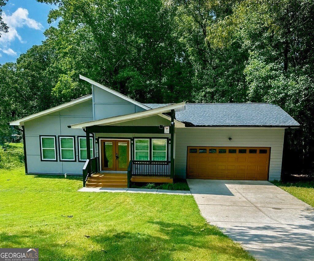 Photo of 7428 Mockingbird Trail, Riverdale, GA 30274 (MLS # 10655698)