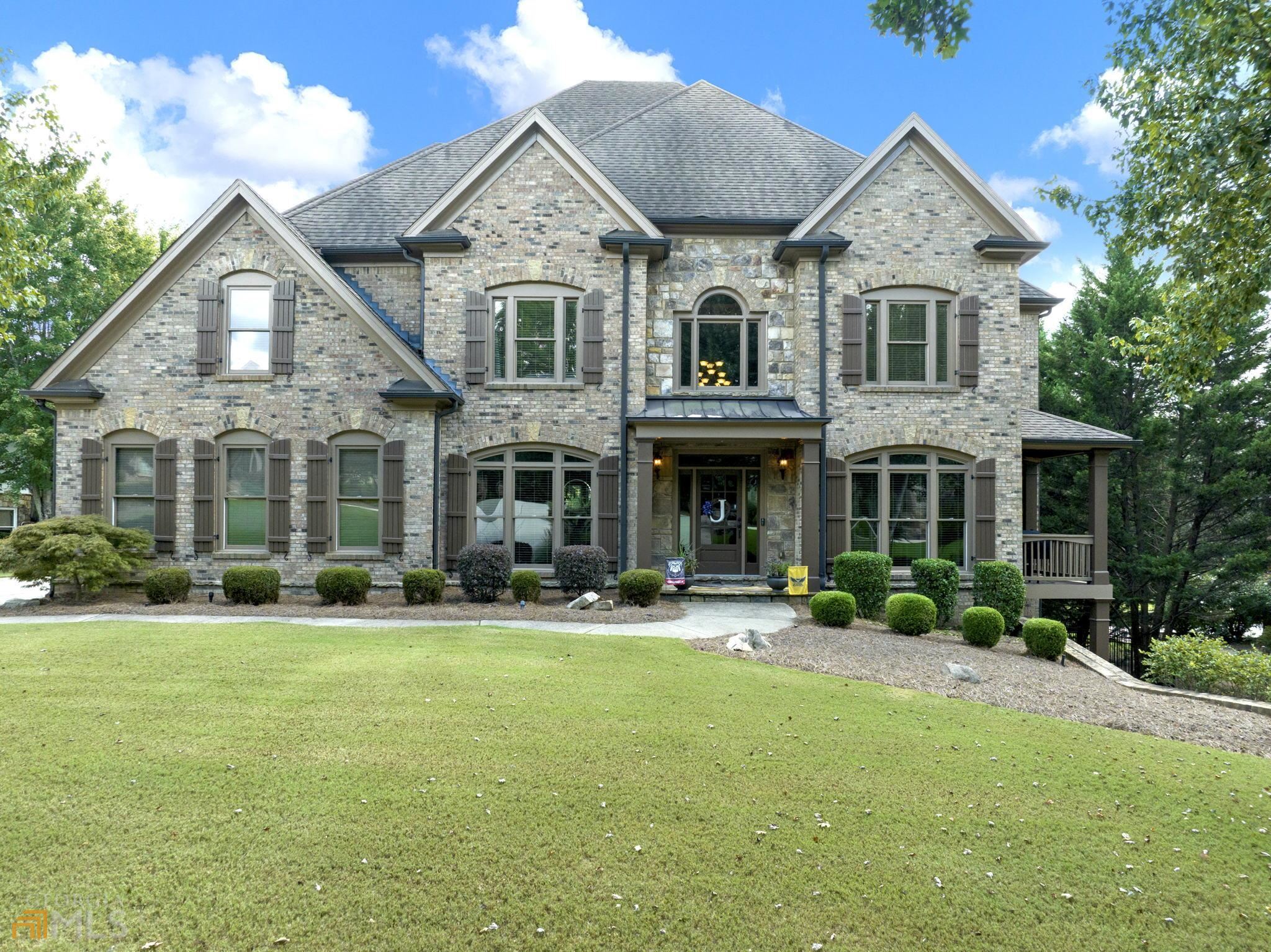 Located in the gated golf course/resort community of Chateau Elan, this 4 sided brick home features 3 levels of finished space with a huge primary suite with sitting room, enormous master closet with laundry room on the upper level along with 3 spacious secondary bedrooms also on the upper level. The two story foyer allows for lots of natural light and is flanked by the dining room to one side and a music room/sitting room to the other side. The kitchen features a true walk in pantry, island/breakfast bar, butlers pantry, breakfast room overlooking the private backyard, views into the great room with fireplace and built-ins. The terrace level is finished with family room, office with built-ins, wet bar, full bath and several other finished rooms to use how you wish (one is currently being used as a work out room). Huge screened in porch is the perfect place to enjoy the outdoors with access to the deck for grilling and sunshine. The backyard is fenced and fairly flat with a slope to one side, which makes for a great play area or possibly a pool. There are also 2 other covered porches, one off of the main level and another off of the terrace level on the back. Level driveway with 3 car garage as well as a large workshop in the garage (could be converted to a golf cart garage). Brand new roof, hardwood floors on the main level and home has had listing inspection we are happy to share. Chateau Elan is a master planned community that is adjacent to the Chateau Elan Resort, Spa and Winery. The community is golf cart friendly, both inside the gates of Chateau Elan and in the areas surrounding the neighborhood via the LifePath that connects to shopping, restaurants and even the medical campus. The neighborhood offers the SportsClub membership to residents only which includes a Junior Olympic size outdoor pool, slides, snack bar, kiddie pool, indoor gymnasium/walking area, fitness center, fitness classes, tennis courts and outdoor sports fields. The SportsClub membership is optional for this home. The community also features 3 18-hole golf courses and a par 3 course (2 courses are owned by the Resort and offer daily play and the Legends is a private membership club). Activities galore including tennis teams, tennis lessons at either the resort or the SportsClub, pickle ball teams, swim team, men's billiards club, women's club, book club, military support group, bible study, neighborhood social gatherings and more. Convenient to Interstate 85 that connects you to all the Atlanta metro area has to offer, within 30 minutes of the University of Georgia campus in Athens, within 20 minutes of Lake Lanier Islands and a short drive to the North Georgia mountains to enjoy the great outdoors! Within 5 minutes from Chateau Elan is the Northeast Georgia Medical Center Hospital and medical campus. This home is located in the award winning Mill Creek Cluster of the Gwinnett County Schools. There are also numerous private schools available as well, some with bus pick-up.  NEW ROOF SINCE THESE PHOTOS WERE TAKEN