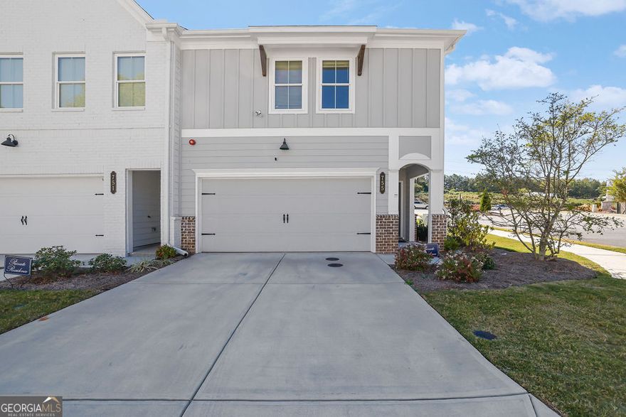 Now priced $10,000 below appraised value!!! Stunning, like-new end-unit townhome located in the highly sought-after Marietta High School District! This home offers a two-car garage and features new LVP flooring throughout the main level and stairs. The open-concept main level showcases a luxury kitchen with white shaker cabinets, quartz countertops, tile backsplash, and an upgraded suite of stainless steel appliances. The kitchen overlooks the spacious living room and adjoining dining area, perfect for entertaining! A half bath and welcoming foyer complete the main level. Upstairs, enjoy a large loft area and three spacious bedrooms with ample closet and storage space. The guest bath features quartz countertops and a luxe shower. The owner's suite boasts a large walk-in closet with custom system and a spa-like ensuite featuring glass-enclosed tile shower, quartz counters, tile floors, and dual vanities. Relax on the back patio with a small yard maintained by the HOA perfect for grilling, relaxing, and pets for easy living. Community amenities include a pool, playground, fire pit, & open green spaces. Gates at Hamilton Grove community is located in Marietta near all the excitement - just minutes from extensive shopping, dining, and recreation including Whole Foods, Kennesaw Marketplace, Town Center Mall, The Marietta Square, Kennesaw Mountain Park and Kennestone Hospital! Schedule your private showing today!