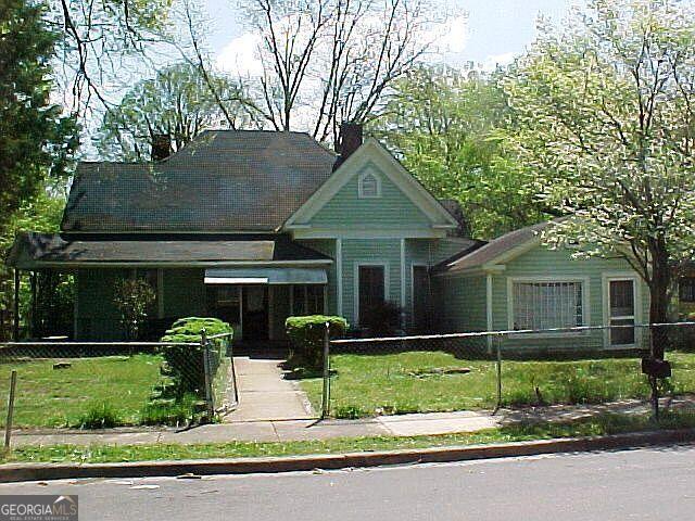 Investor special in Rome, GA! This spacious 5 bed, 2 bath home offers 2,200 sqft of opportunity with tons of meat on the bone- a fix and flip, BRRRR strategy, or rental. Located in a quiet, established neighborhood, the property has solid bones and a generous lot, just waiting for the right investor to bring it to life. With strong ARV potential and plenty of room to add value, this is a true diamond in the rough. Don't miss your chance to capitalize on this high-upside deal!