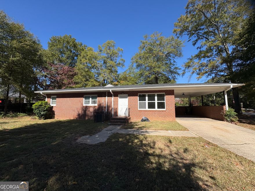 Nestled in the heart of Monroe, Georgia, this 3-bedroom, 1-bathroom brick home offers 1,180 sq ft of comfortable living space and sits on a generous 0.46-acre lot. Built in 1964, the residence showcases a mix of hardwood and carpet flooring, creating a warm and inviting atmosphere. The kitchen delivers efficient layout and a functional space for family meal prep. Outside, you'll find a spacious yard-ideal for gardening or weekend relaxing-and while there is no formal fence, the ample lot provides room to add your own enclosure or play area. Located minutes from downtown Monroe's shops and restaurants, with easy access to major roads and just a short drive to regional amenities. Enjoy being within reach of local parks, community events, and the scenic charm of small-town Georgia. The nearest beach along Georgia's coast is approximately 75 miles away, making this home more about serene inland living with day-trip beach access.