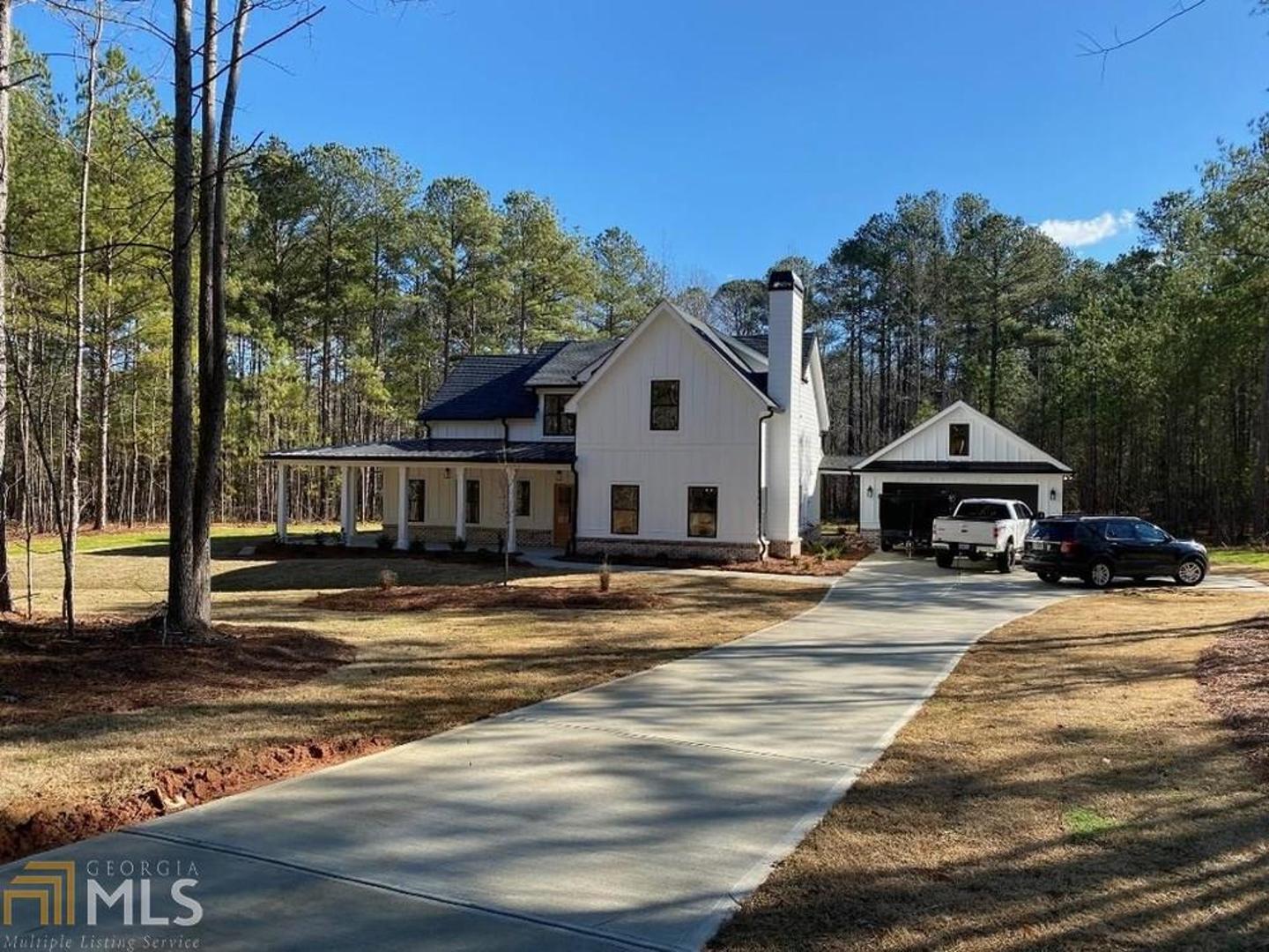 Gorgeous Farmhouse Home on 2+/- acres with private backyard, outdoor fireplace, 2 car garage with additional storage. Open floor plan with mudroom, home office, master bedroom offers private access to porch, separate closets, double vanity, free standing soaking tub, over-sized shower with dual shower heads and beautiful tile detail. Second floor offers separate living room, secondary bedroom with private bath and 2 additional bedrooms which share a jack-n-jill bathroom. Upgrades abound in this custom built home! From the spray foam insulation, herringbone in-lay fireplace, upgraded windows ...all the way to the door hardware. You will want to see this one in person!
