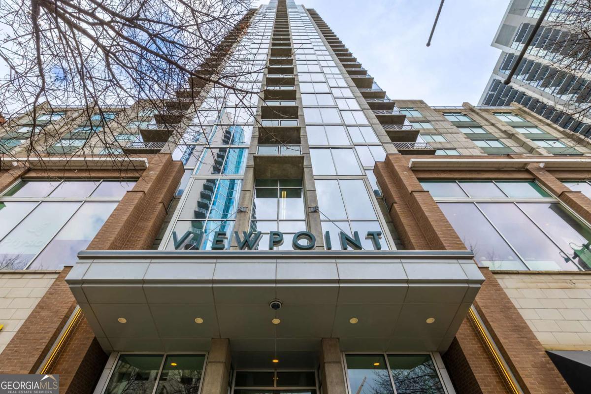 Experience the best of city living in this stunning Midtown Atlanta condo! Perched on the 19th floor of the iconic Viewpoint building, this spacious residence boasts striking architectural details, a versatile bonus room perfect for a guest suite or home office, and breathtaking skyline views. Modern upgrades include WiFi smart switches compatible with Google and Alexa, as well as an Ecobee smart thermostat for ultimate convenience and efficiency. The Viewpoint offers top-tier amenities, including a 24-hour concierge, a resort-style pool, a state-of-the-art fitness center, and unbeatable walkability to MARTA, the Fox Theatre, grocery stores, shopping, and Piedmont Park.