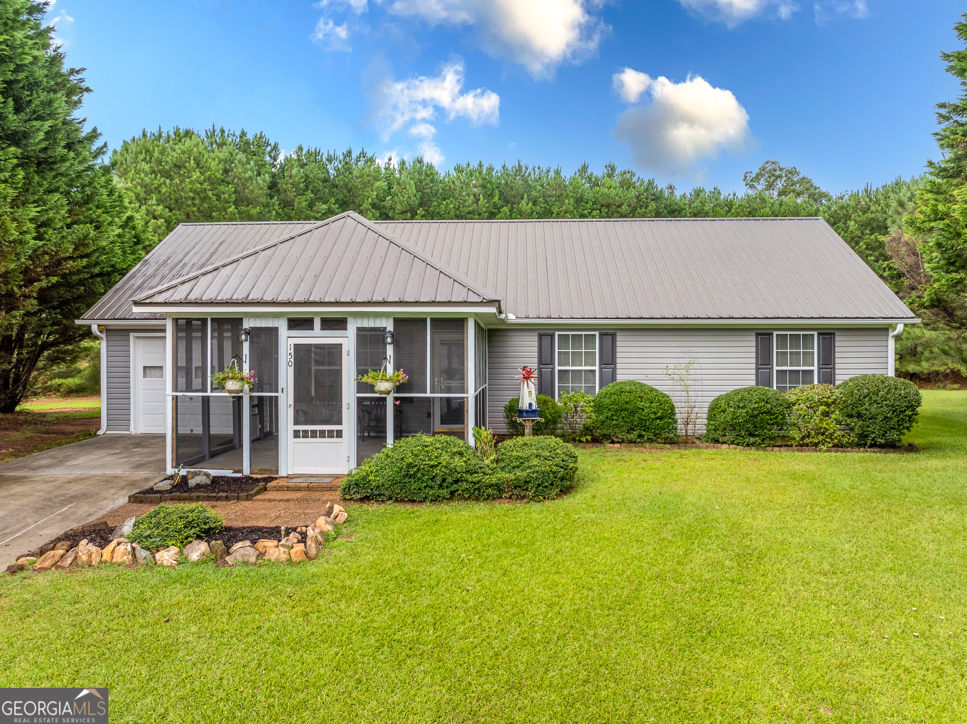 Peaceful One-Level Living on Over 1 Acre-Welcome to Juniper Drive-Located in the Wyngate subdivision in Ellijay, this charming 3-bedroom, 2-bath ranch home sits on over an acre in a quiet cul-de-sac with friendly neighbors and a serene mountain life setting. It's an ideal retreat for retirees seeking low-maintenance living or a great starter home for a small family-Enjoy easy, one-level living on a full slab foundation-no stairs to navigate! This home features updated appliances, low-maintenance vinyl siding, a garage, and screened porches for relaxing outdoors. The fenced backyard is perfect for pets, gardening, or simply soaking in the peaceful surroundings. All paved roads at a prime location just minutes to downtown Ellijay, Carters Lake, award-winning vineyards, orchards, shopping, dining, and scenic hiking and biking trails. Bonus for buyers 65 and older: Full-time Gilmer County residents are exempt from school taxes, making this an especially smart and affordable choice for retirement living. Don't miss this rare combination of comfort, convenience, and community-move-in ready and waiting for you!