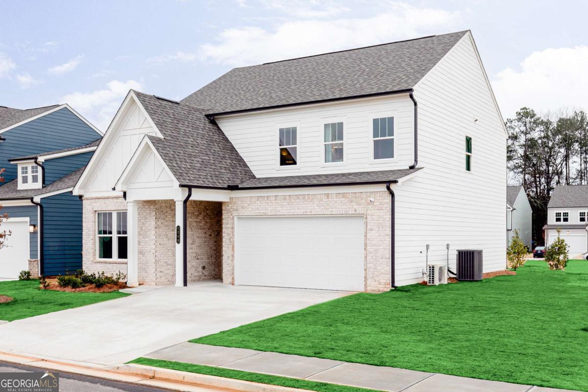 Welcome to Madison at Buice Lake, the new Stanley Martin Master Planned Community in Acworth, GA! LOT 39. ALL IN - ZERO HIDDEN PRICING. ESTIMATED COMPLETION DATE IS OCTOBER 2025. In the MAISIE flooorplan, you can mix and mingle with friends and family in your open-concept first floor, which includes a kitchen overlooking the family room and dining area. A bedroom at the front of the home can be used for guests to have their own private space. Upstairs, the owner's suite boasts a large walk-in closet off the en suite bathroom with double vanities. Three other bedrooms provide the perfect place for family or friends to rest their heads at night. Plus, take the chore out of doing the laundry with a conveniently located laundry room on the upper level! A full bathroom and an additional flex space as a play space, home office or crafting nook, to name a few - it's truly what you make of it! Some of the SMart Selected design options in this home include a gourmet kitchen & center island, large owner's suite with walk-in closet and en suite bath, patio, main level guest suite with full bath, and upper-level flex space. *Photos are shown of a similar home