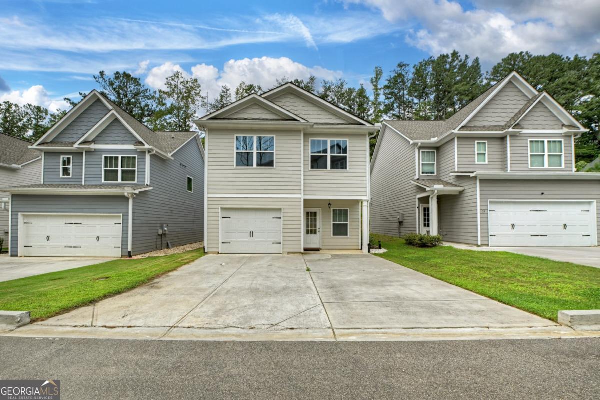 WELCOME HOME to this amazing home nestled in the quiet, FAMILY-FRIENDLY COMMUNITY of Hood Park Villas. This beautiful 3-bedroom, 2.5 bath, 1,792 square foot home blends comfort, style, and convenience in a growing neighborhood. The inviting layout begins with a one-car garage that opens into the spacious open-concept living, dining, and kitchen area featuring durable LVP flooring, granite countertops, tall ceilings, a kitchen island, pantry, stainless steel appliances, and soft-close cabinetry. A convenient half bath with pedestal sink is also located on the main level, along with sliding glass doors that lead to a private patio for outdoor enjoyment. Upstairs offers three bedrooms, two full baths, and a hallway laundry area. Step into the DREAMY and OVERSIZED PRIMARY BEDROOM with his-and-her closets and an ensuite bath with a large granite counter and a tub/shower combo. Enjoy two additional bedrooms and a full bath with granite vanity complete the upper level. Nestled in the quiet, FAMILY-FRIENDLY community of Hood Park Villas, this home blends comfort, style, and convenience in a growing neighborhood perfectly located just minutes from downtown Jasper, Hwy 515, Publix, shopping, and more. Don't miss the opportunity to make this your next dream home!