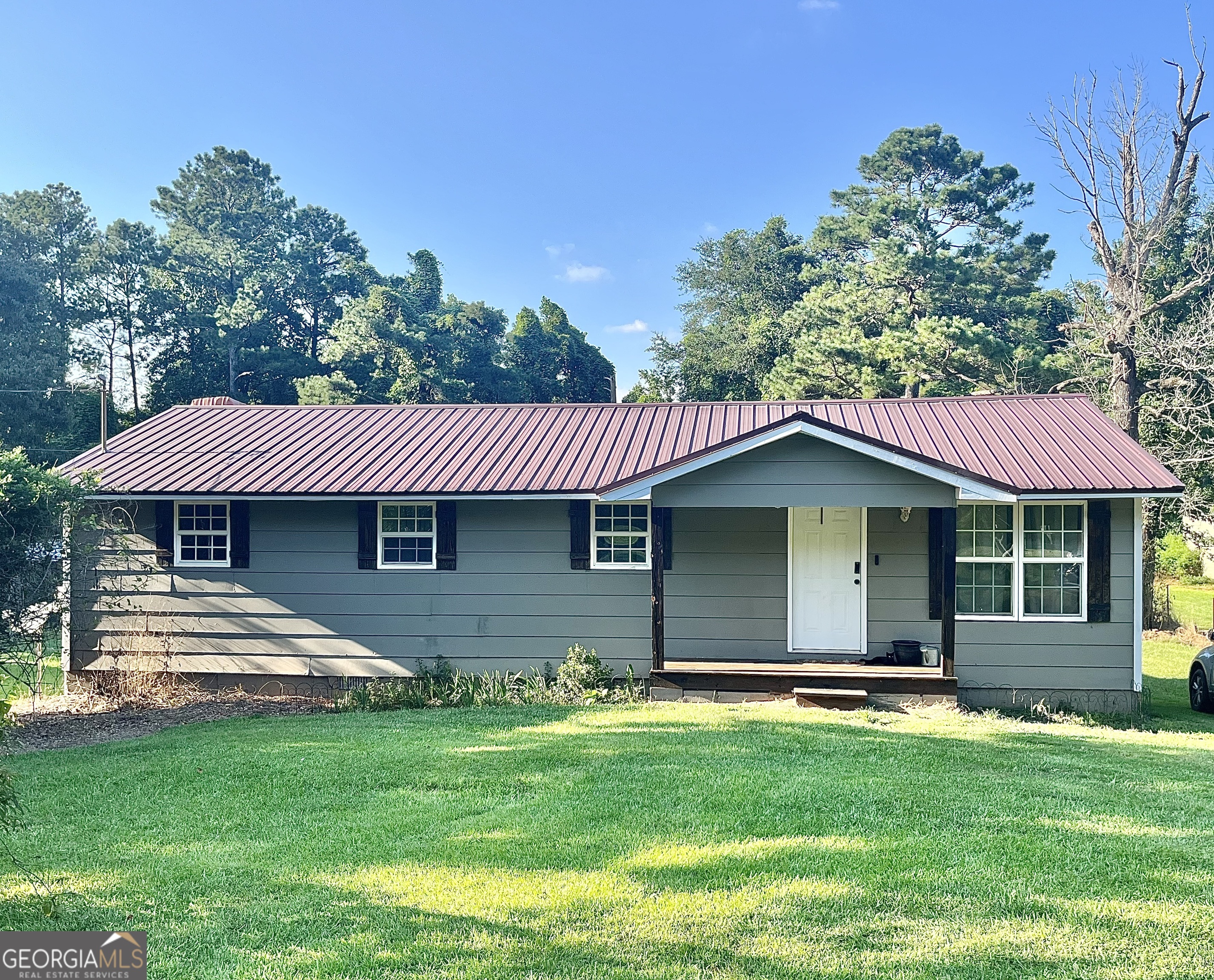 Charming and full of potential, this cozy 4-bedroom, 1-bath home is the perfect blend of comfort and character. Featuring beautiful hardwood floors, this home offers warmth and durability in every room. The metal roof adds peace of mind and low maintenance living for years to come. Step outside to enjoy the partially fenced backyard, an ideal space for kids, pets, or a simple garden retreat. With its manageable size and thoughtful layout, this property is a great option for first-time buyers, downsizers, or investors looking for a rental opportunity. Affordable and inviting, this home is waiting for its new owner to make it their own!
