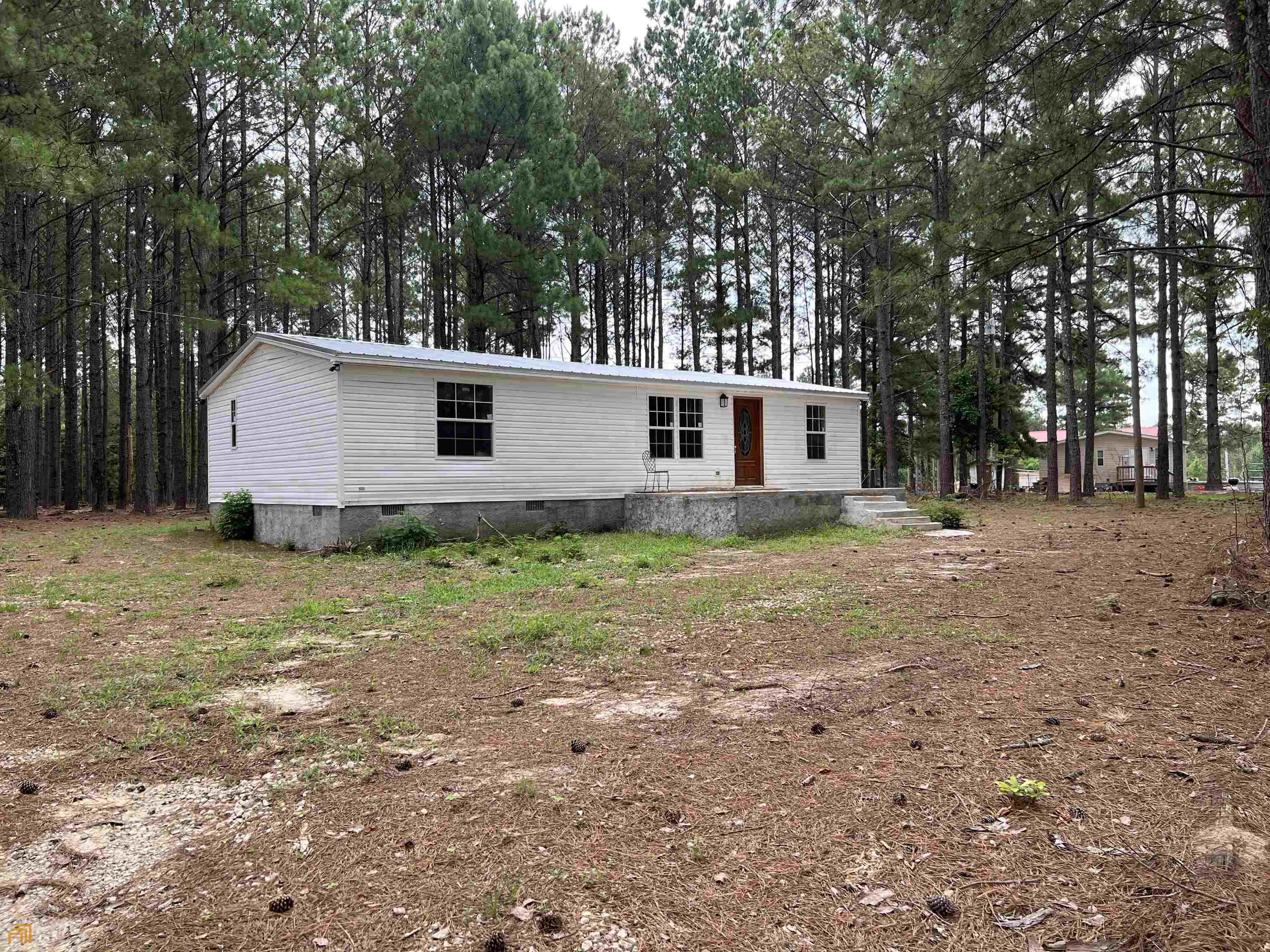 Want room for all the stuff and a place to plant yourself? This single wide has been updated with new flooring, new tile in bathrooms and new appliances. This three bedroom to bath in Crawford County is great for the first time home buyer. Bring the family, bring the animals.