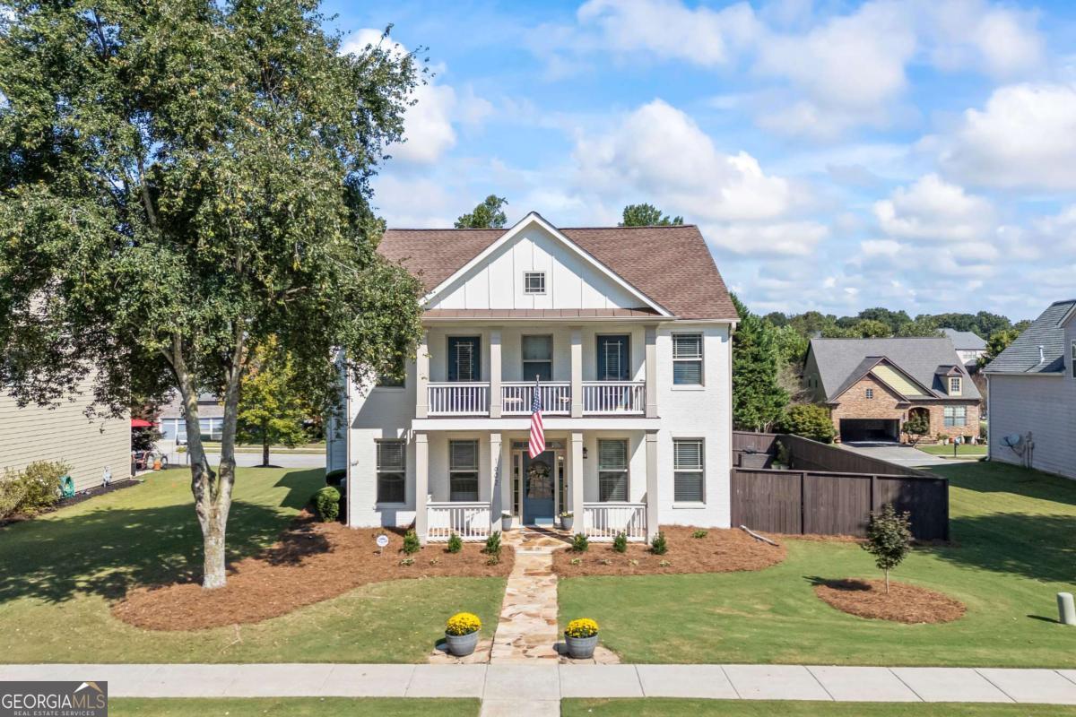 Welcome Home! This stunning 4 Bed / 2.5 Bath home is located in the sought-after Falls of Braselton Subdivision with close access to food, shopping, and I-85 access. Features of this home include spacious living areas, balcony, prewire for electrical car, and a dedicated office space, ideal for working from home or quiet study. Upstairs, the oversized primary suite feels like a retreat with its private sitting area, spacious walk-in closet, and spa-like bathroom featuring heated floors and a soaking tub. Outside features a fully fenced backyard with a built-in fire pit, perfect for evenings outdoors. Just a short walk from your door, you'll find neighborhood amenities including a pool, tennis courts, pickleball, a park, and direct access to the Mulberry River walking trail. With its prime location and well-designed spaces, this home offers the lifestyle you've been looking for in Braselton.