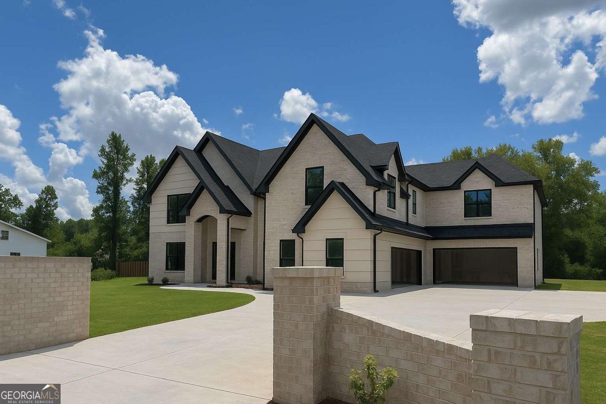 Homes like this don't last. Scheduled completion end of September, ready for you to move right in, this privately gated luxury home is perfectly positioned on a premium corner lot just off Braselton Highway on a cul de sac street and is designed to deliver both elegance and modern functionality. With 2 kitchens, 5 spacious bedrooms, 5 full baths, 2 half baths, and 2 laundry rooms, this residence combines thoughtful architecture with stunning high-end finishes throughout. Step through the impressive two-story foyer into an open-concept living space featuring 10-foot ceilings on both main and second floors, black-framed 6-foot windows, custom millwork, electrical floor outlets, and designer lighting. The chef's kitchen will be a true showpiece with an extra-large center island, premium Z Line appliances, stone countertops, custom cabinetry, a white porcelain farmhouse sink, and a second prep kitchen equipped with its own dishwasher and range with exterior-vented exhaust-ideal for entertaining. The separate dining room offers a sophisticated setting for gatherings, while the main-level living room features a grand fireplace, hand-painted Venetian Plaster finishing, and opens seamlessly to a covered patio with outdoor kitchen. The main-level primary suite is a private retreat, complete with a fireplace, spa-like bathroom, dual vanities, and a large custom walk-in closet. A main-level mudroom and laundry provide convenience, and the home has two separate two-car garages with 220-volt outlets for electric vehicles in each. Upstairs, four generously sized bedrooms each feature a private ensuite bath and walk-in closets. The upper level also includes a dedicated office, a media/loft room with wet bar and fireplace overlooking the downstairs family room, and a second laundry room and guest bath. Additional highlights include three fireplaces, black metal stair rails, a irrigation system, a 2000-gallon septic tank, foam-insulated attic, three thermostats, two HVAC systems, upgraded lighting packages, and under-cabinet lighting. With its rare combination of architectural elegance, high-end finishes, and a prime gated cul-de-sac location, this over 6,800 sq ft estate offers a truly elevated lifestyle. Every inch has been thoughtfully designed for comfort, luxury, and effortless entertaining-from the chef's dream kitchen and private owner's retreat to the expansive backyard with space for a pool. Experience the pinnacle of refined living in this one-of-a-kind new construction home. Schedule your private tour today and step into unmatched sophistication and craftsmanship. Must have an appointment to go inside - call today