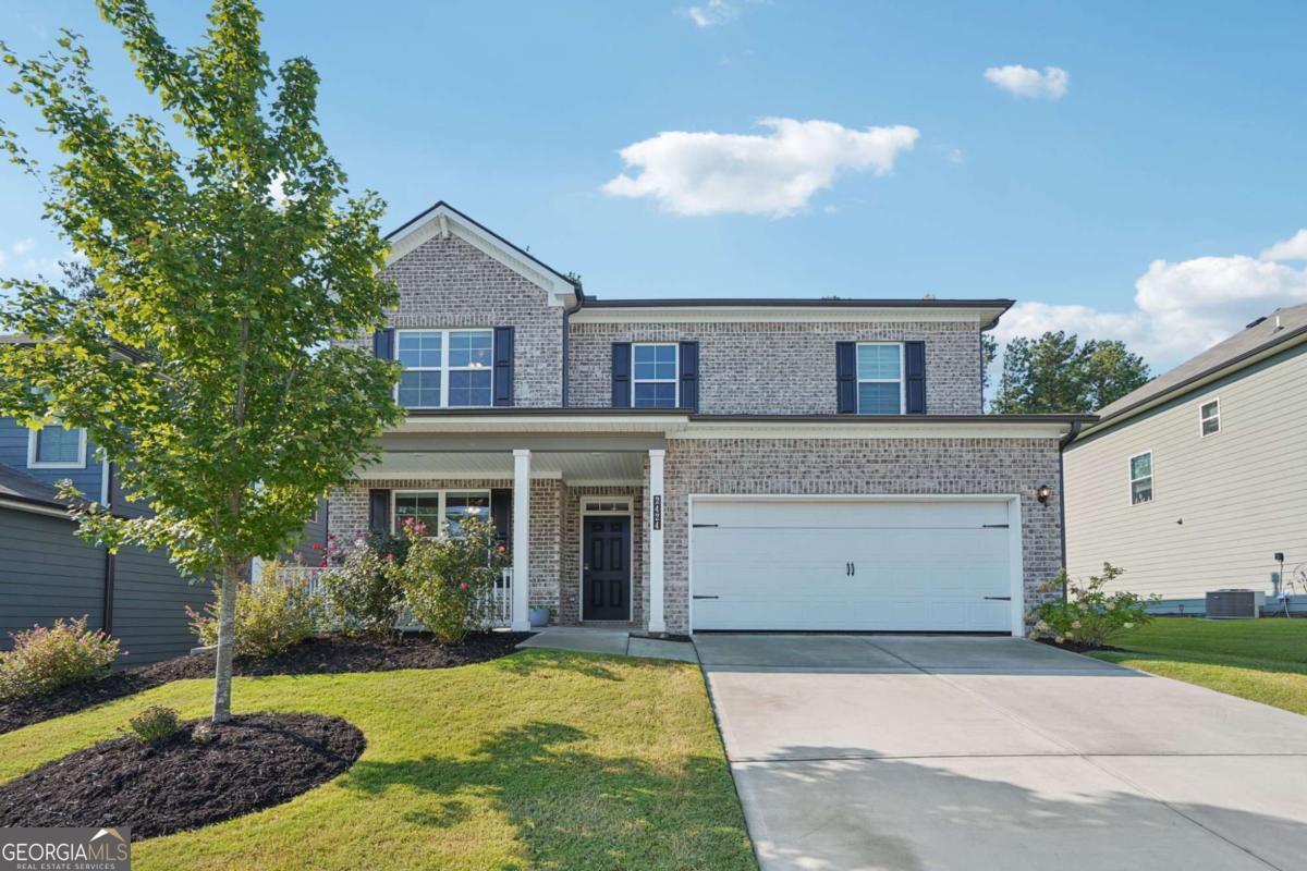 This isn't just another Grey Birch by Century Communities - it's the only 5-bed, 4-bath home built after 2021 in the Seckinger school cluster at this price. With over 3,000 sq. ft. of thoughtfully designed space, this meticulously maintained, like-new home delivers the upgrades and family oriented community your family needs. The main level invites you in with an open kitchen wrapped in quartz, Tahoe painted harbor cabinetry, stainless steel appliances, a walk-in pantry, and a center island that begs to be gathered around. The family room is anchored by a slate-framed fireplace, and a full guest suite on the main makes hosting effortless and enables multi generational living. Upstairs, the primary retreat shines with a tiled shower, marble vanities, a soaking bathtub and closet space you'll actually use, while three more bedrooms and a loft is perfect for a growing family and cozy movie nights. Additional Highlights include: Luxury Vinyl flooring, tiled baths, covered patio with a lovely garden and generous backyard, epoxy-finished garage with overhead racks and cabinets. Security is handled with a Schlage code lock and Safe Haven system. Zoned for top-rated Ivy Creek, Jones, and Seckinger schools, and just minutes to Duncan Creek Park, Hamilton Mill Library, Goldfish Swim School, CVS and a bustling restaurant scene. The vibrant neighborhood is alive with kids on bikes, a pool, clubhouse, and playground. Investor-friendly: **NO RENTAL RESTRICTIONS** Clean, modern finishes, smart-home tech, and thoughtful storage make this beautiful home a rare, turnkey option. Come grab it before it's gone.