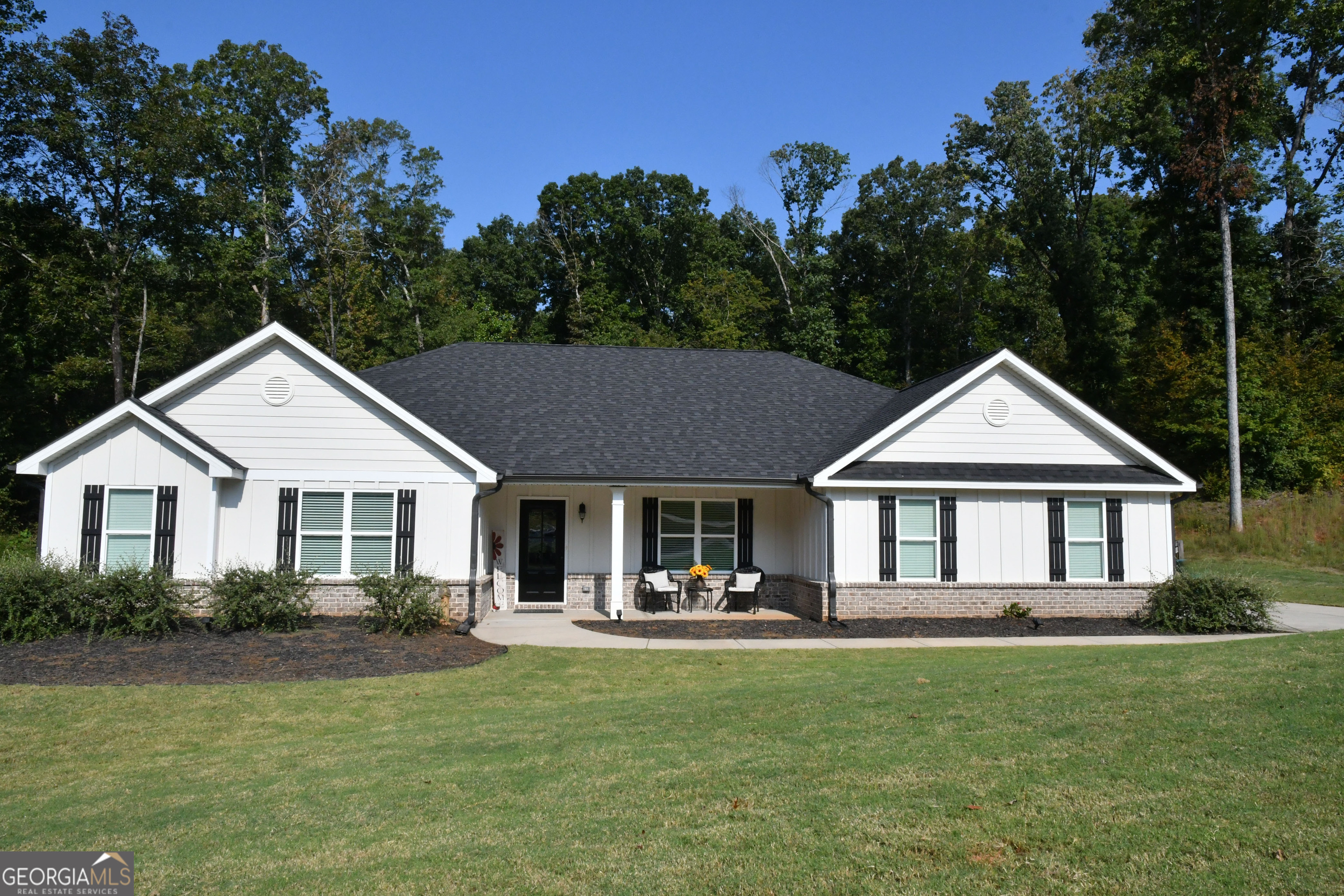 * Welcome home to this pristine, almost new 4 bedroom, 3 bathroom stepless ranch nestled in the highly sought after Oconee Pointe community. 100% USDA financing eligible - no HOA - this one's ready for you. Home features: Stepless floor plan for easy access throughout, entry foyer leading into a separate formal dining room with double tray ceiling, huge family room anchored by a corner fireplace and filled with natural light. The open kitchen features a central island/breakfast bar, custom cabinets, granite countertops, tiled backsplash, and a large walk in pantry. Fabulous Breakfast room overlooking a lush, private backyard. Spacious Owner's Suite with an enormous walk in closet. Owner's bath features a soaking tub, separate shower, and double vanity. The room-mate floorplan offers privacy and the secondary bedrooms roomy, with ample closet space, two share a Jack and Jill bath. Must see the oversized covered back patio that is perfect for relaxing or entertaining. Enjoy your fully fenced back yard that offers you privacy and serenity. Welcome home to this nearly new home in a prime location: close to schools, shopping, downtown Commerce and easy access to I 85 and Athens. Sellers have flexibility to close quickly. This home blends upscale features and thoughtful design in a single level layout. The lack of HOA means more freedom; stepless makes it accessible. Add in the private backyard and covered patio-and excellent location-and you have a rare find in Oconee Pointe.
