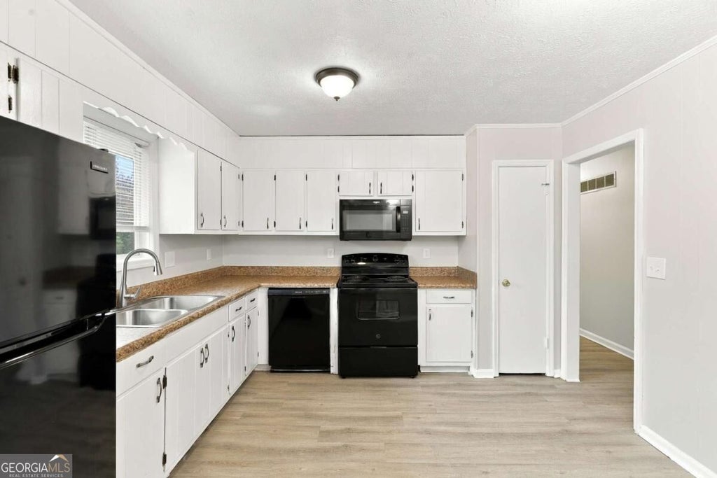 Photo of 6450 Ashdale Drive, Atlanta, GA 30349 (MLS # 10871428)